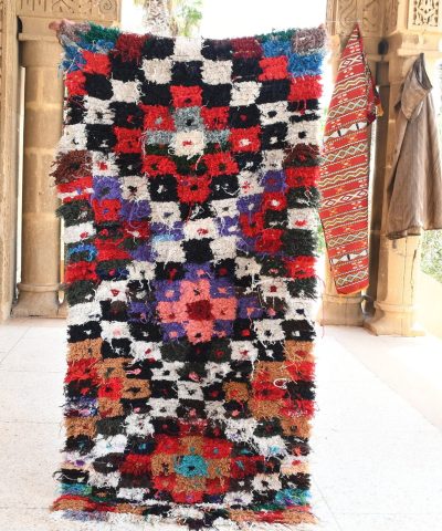 a colorful rug is hanging on a wall. il_fullxfull.6028227472_ri8d.jpg