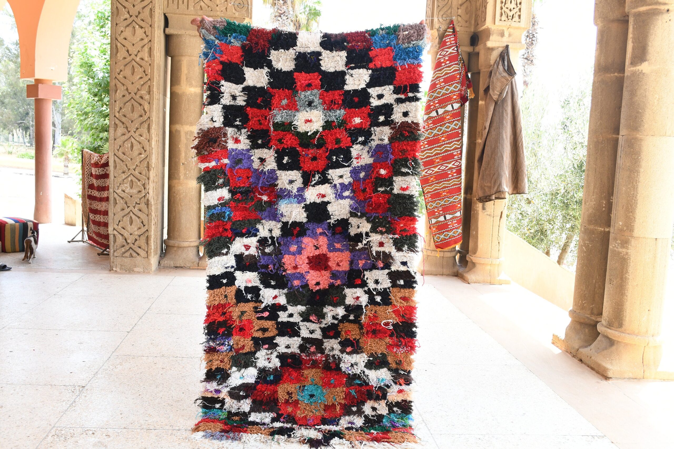 a colorful rug is hanging on a wall. il_fullxfull.6028227472_ri8d.jpg