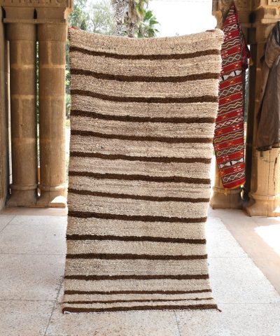 a rug is hanging on a wall. il_fullxfull.6028229030_hsik.jpg