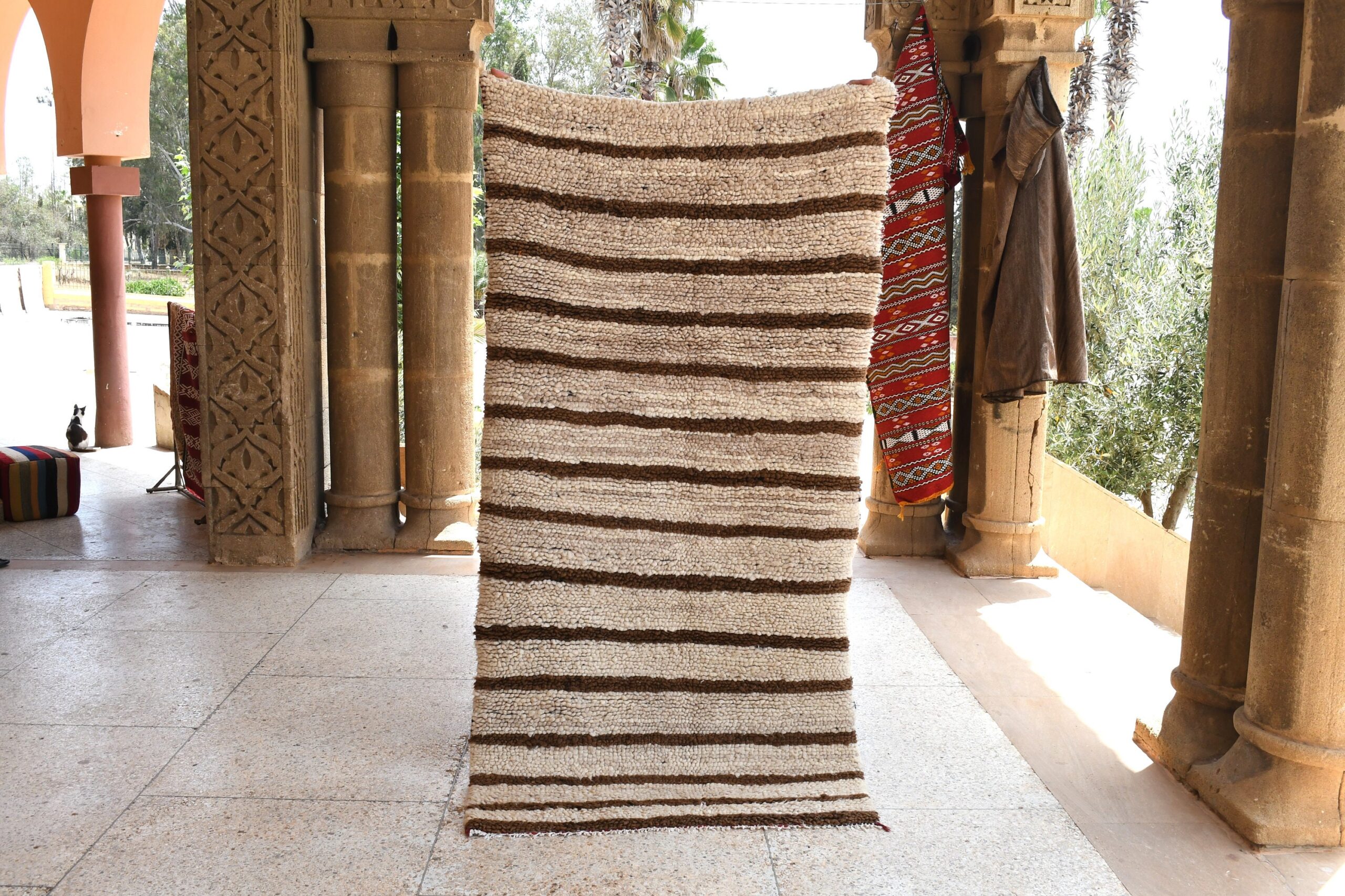 a rug is hanging on a wall. il_fullxfull.6028229030_hsik.jpg