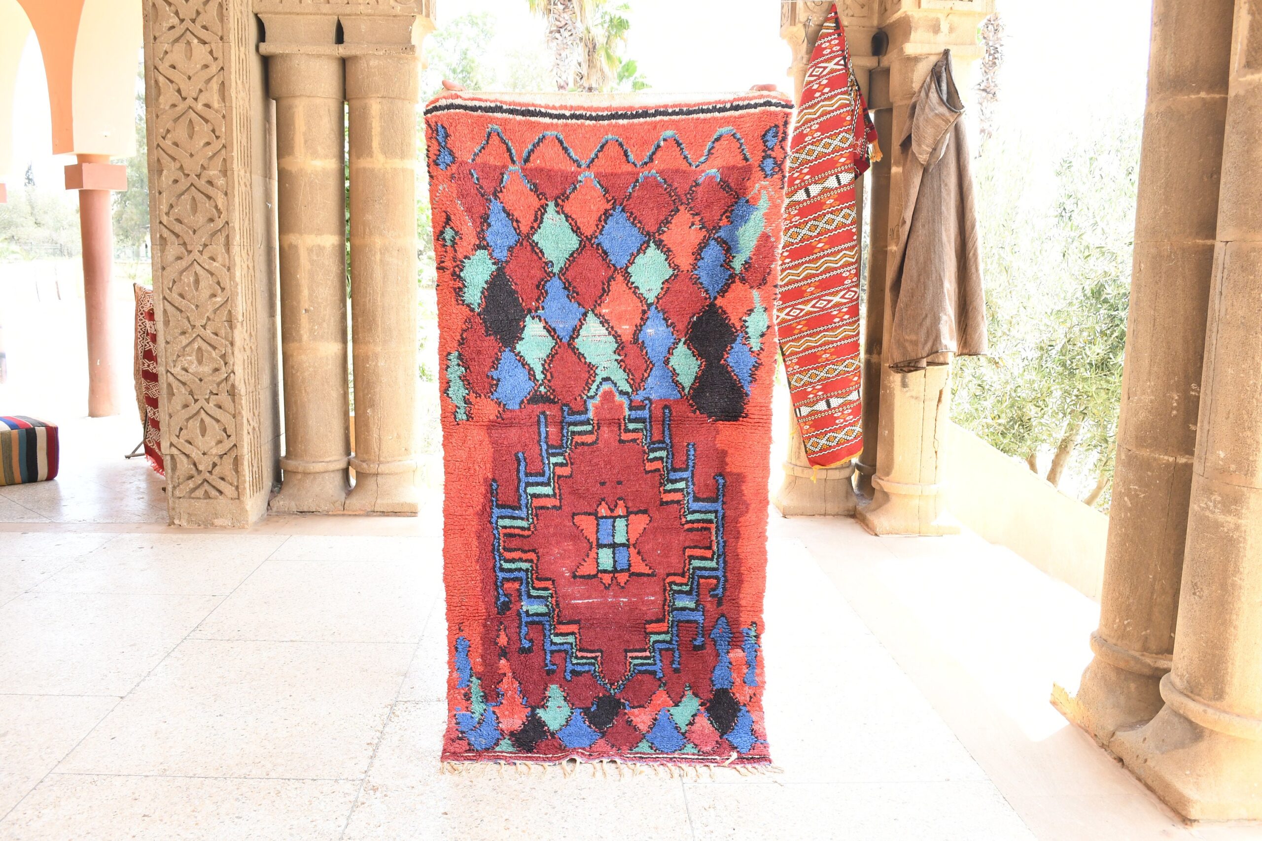 a colorful rug is on display in a room. il_fullxfull.6028232776_fqn4.jpg