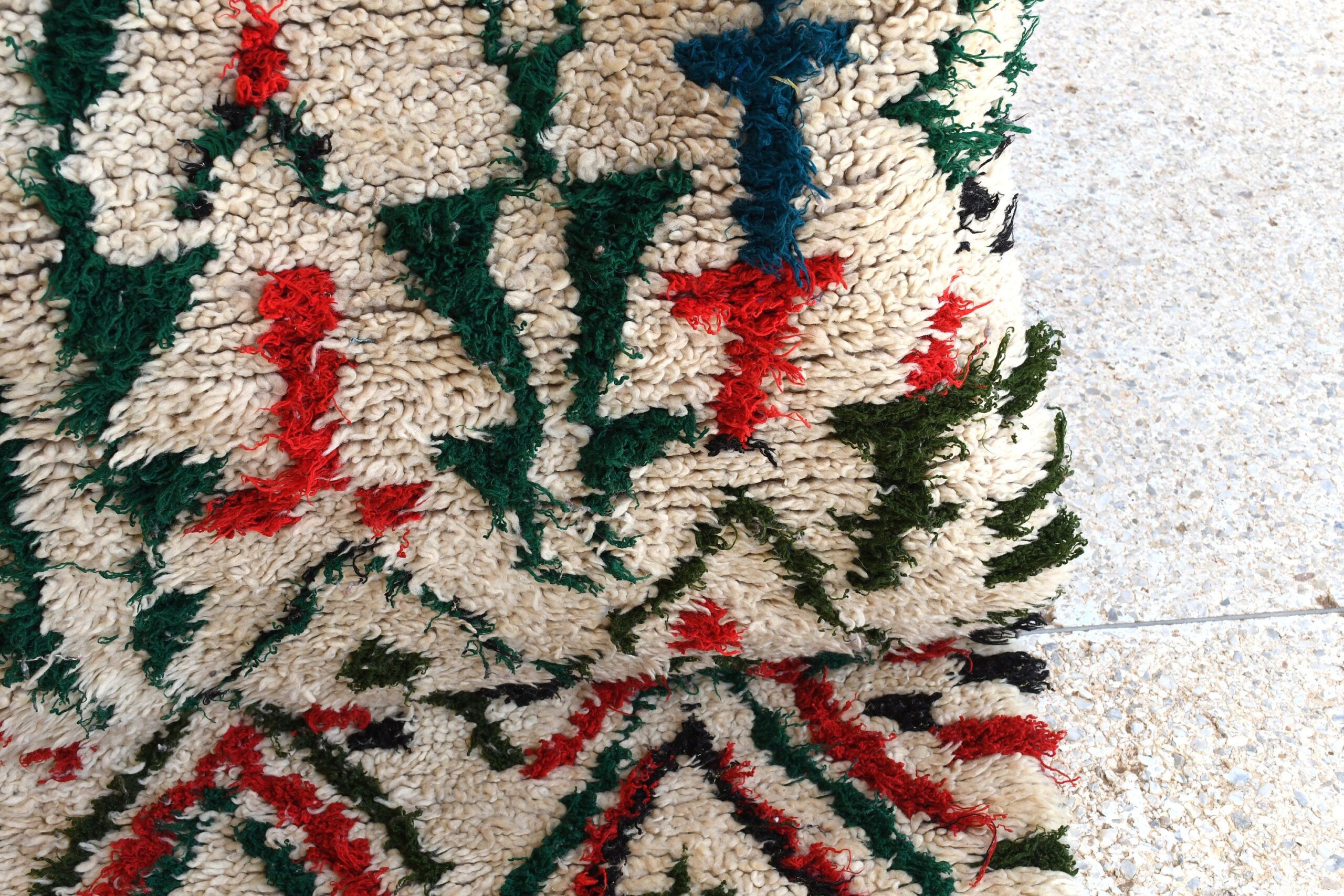 a pile of white and red rugs. il_fullxfull.6028242294_bffa.jpg