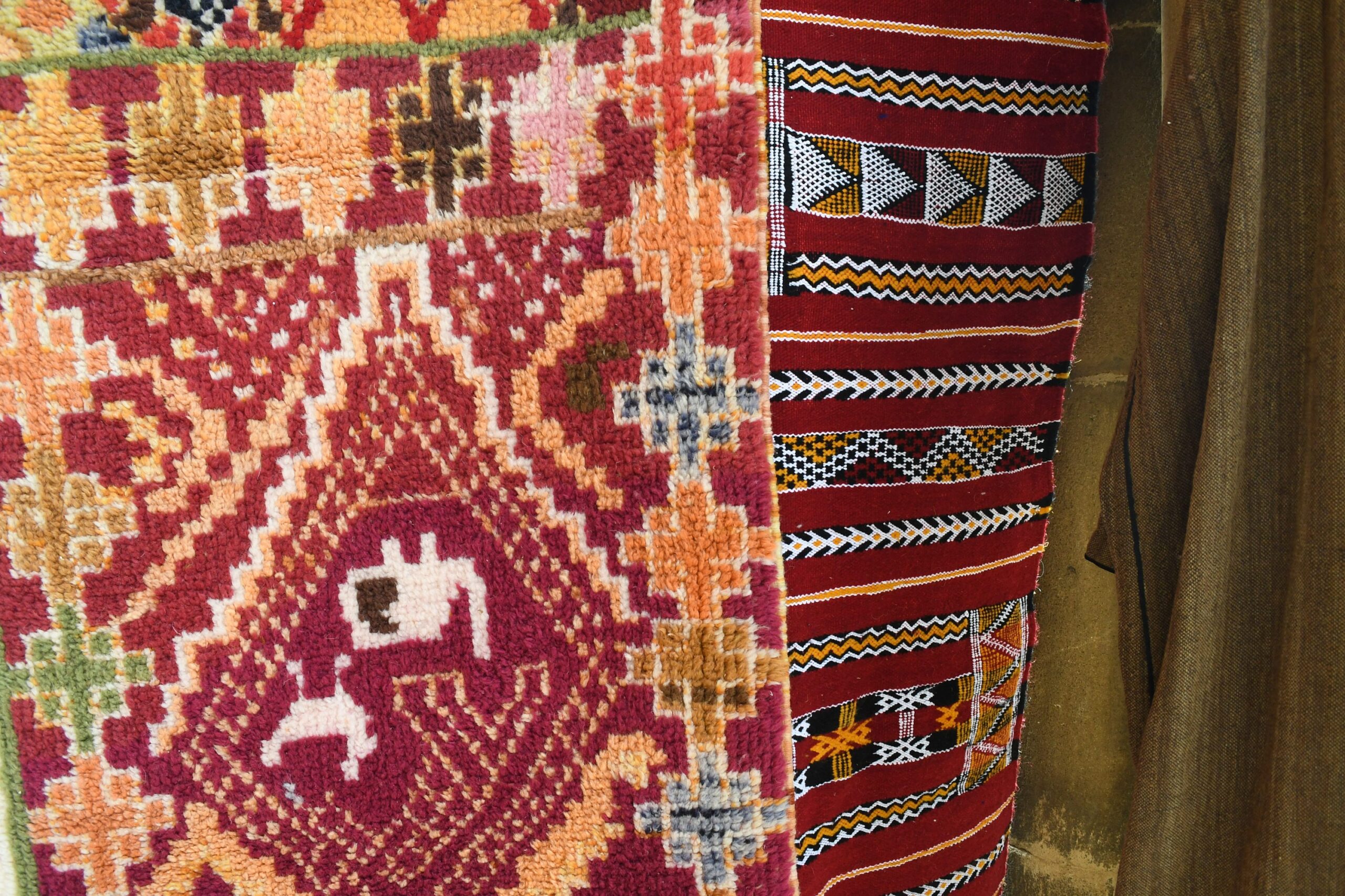 a colorful rug hanging on a wall. il_fullxfull.6035022324_r89y.jpg