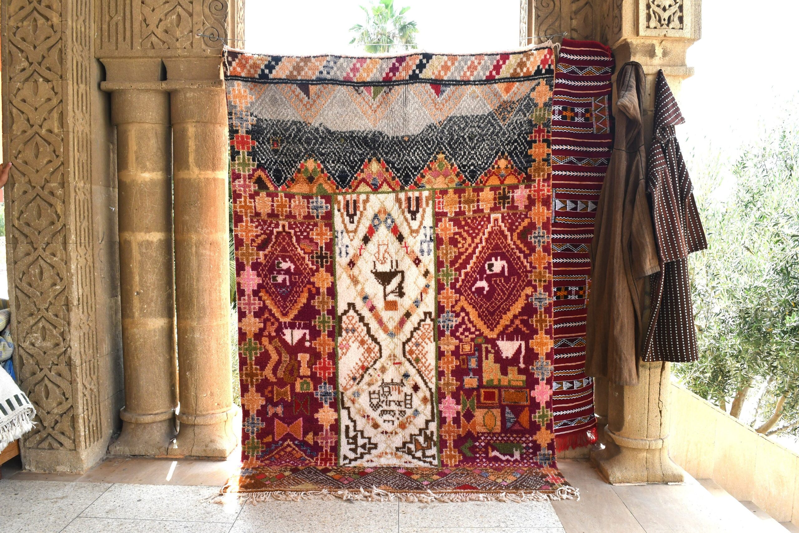 a colorful rug hanging on a wall. il_fullxfull.6035022894_7vm1.jpg