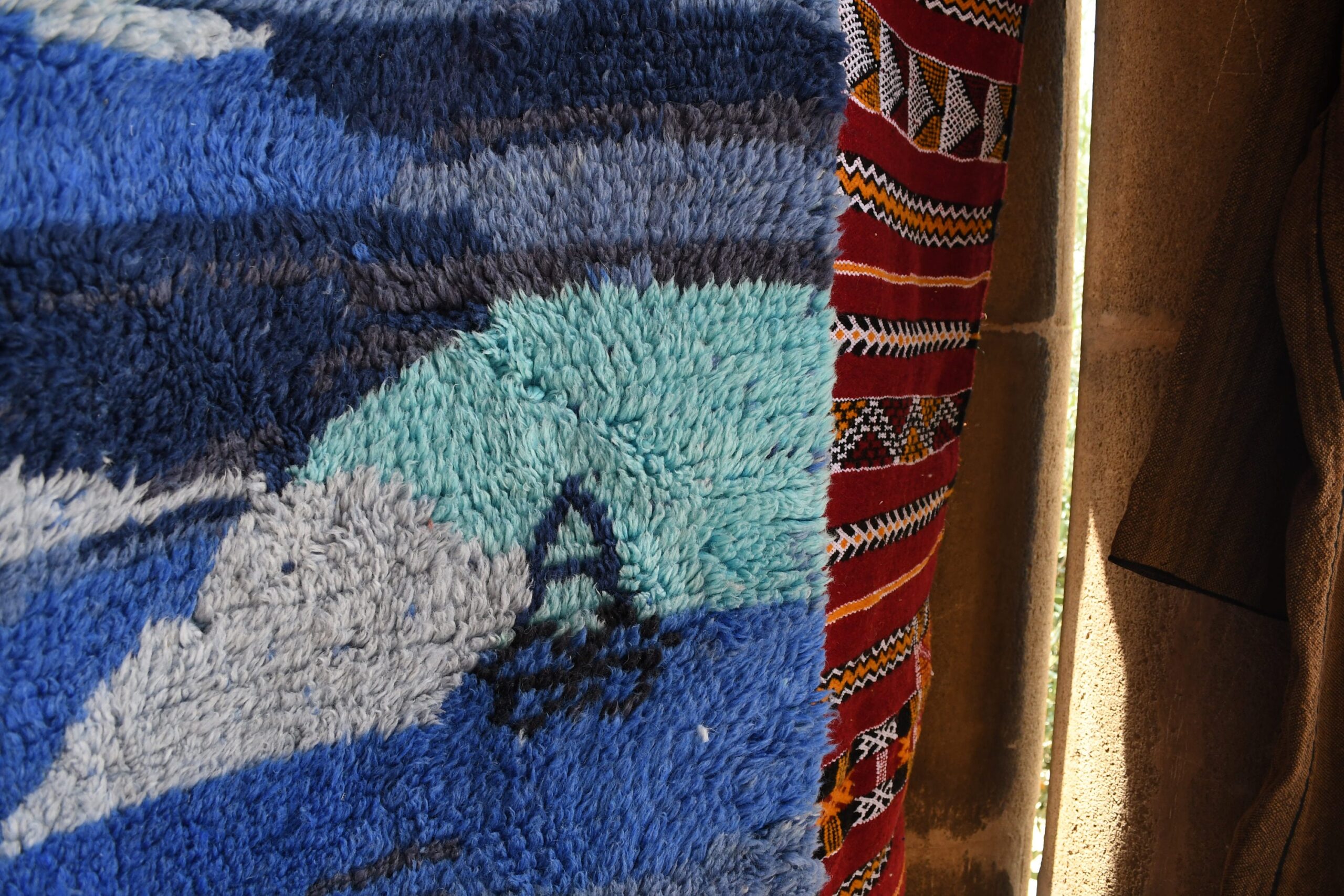 a blue and red rug. il_fullxfull.6035027288_lyg2.jpg