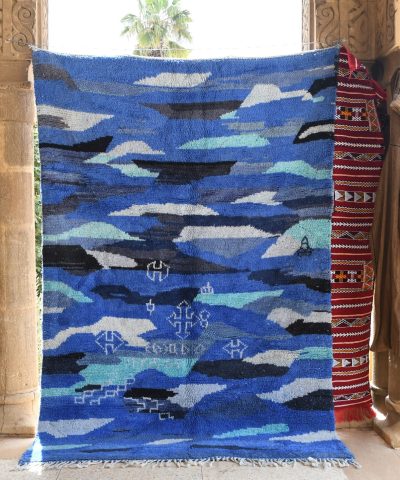 a blue rug with a blue and white design. il_fullxfull.6035027806_cxrv.jpg