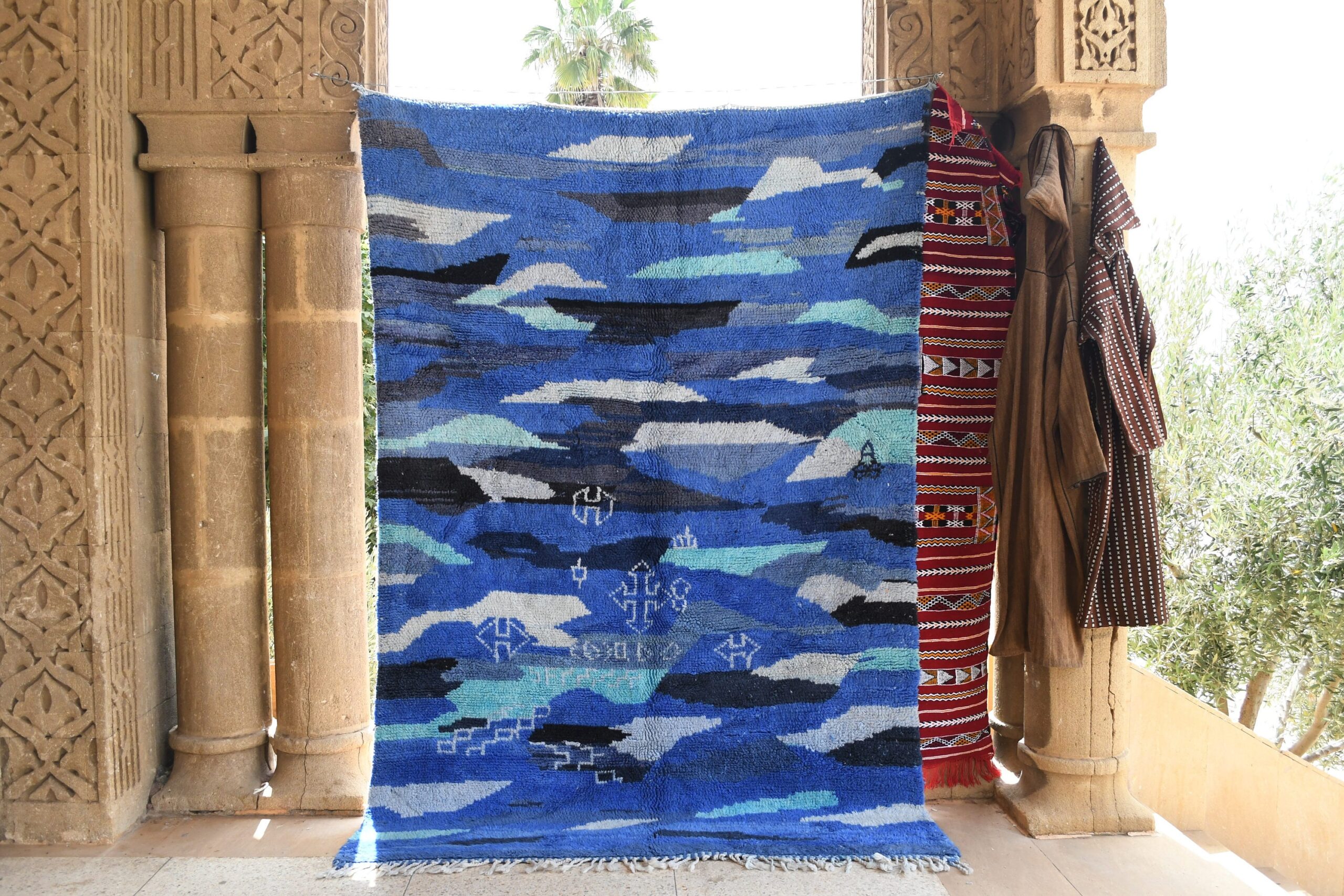 a blue rug with a blue and white design. il_fullxfull.6035027806_cxrv.jpg