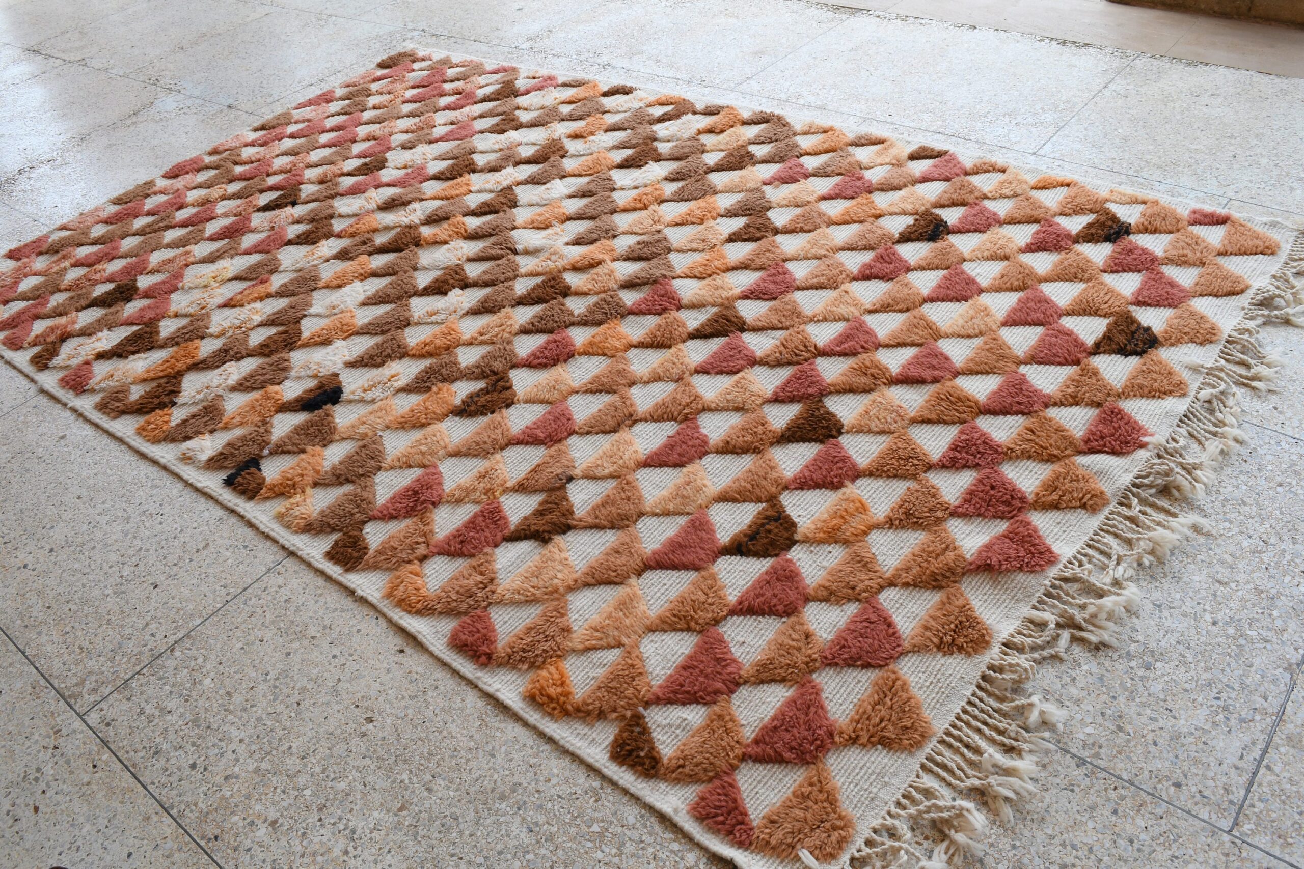 a rug with a pattern of triangles on it. il_fullxfull.6035037846_j4bp.jpg