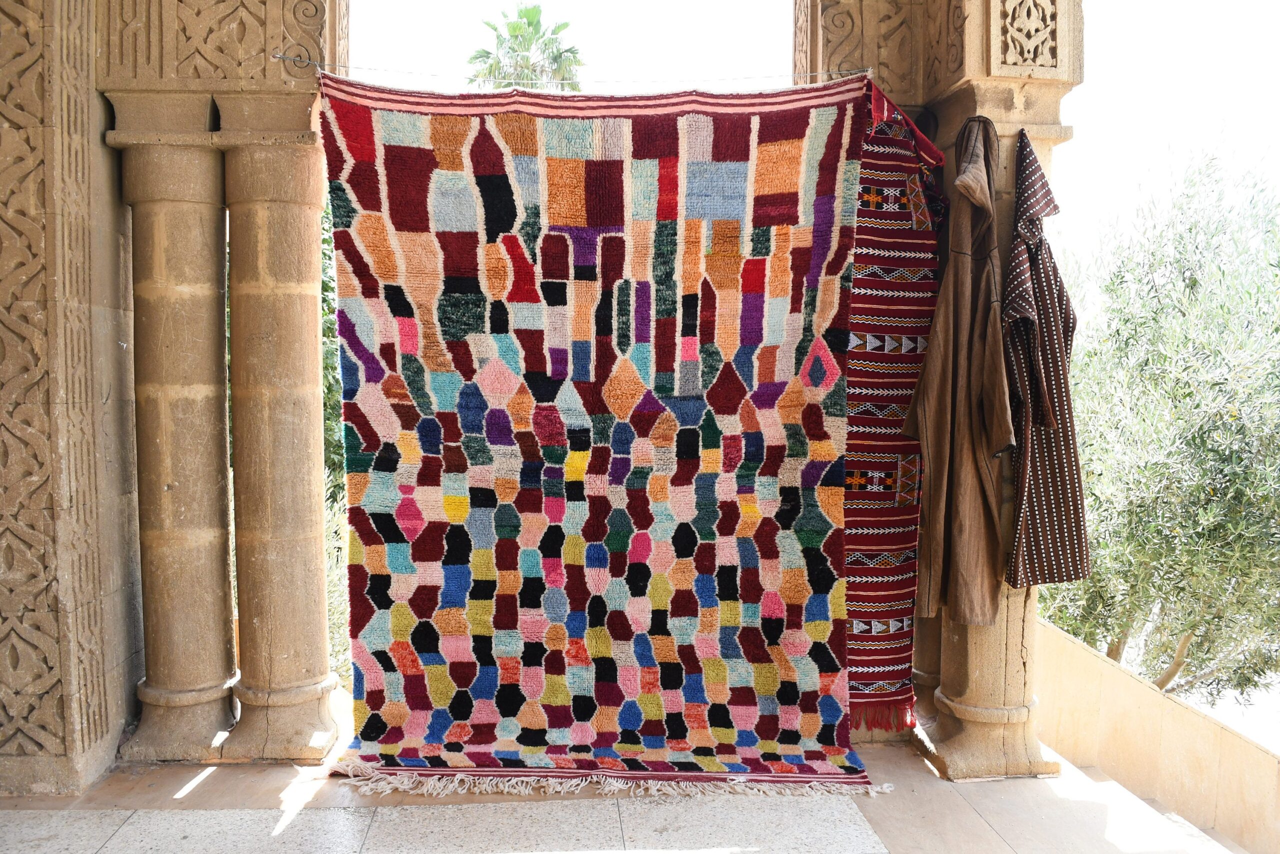 a colorful rug hanging on a wall. il_fullxfull.6035044208_da6h.jpg