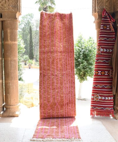 a red rug is hanging on a wall. il_fullxfull.6035048890_axld.jpg