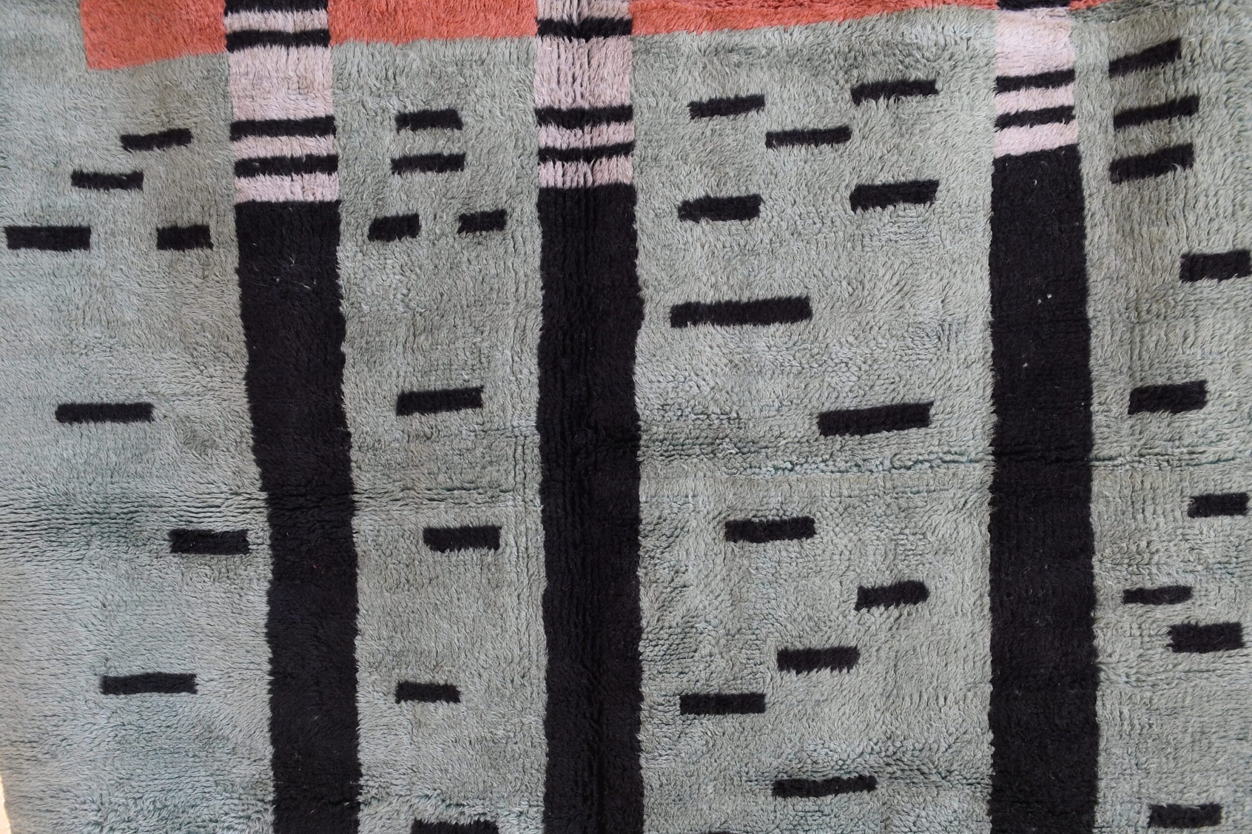 a rug with a black and white pattern. il_fullxfull.6035049808_l8ph.jpg
