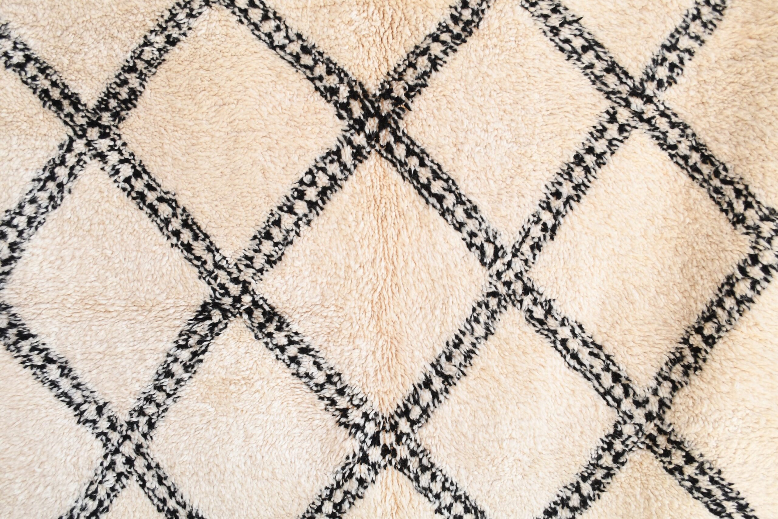 a white and black rug with a diamond pattern. il_fullxfull.6035054278_gh1o.jpg