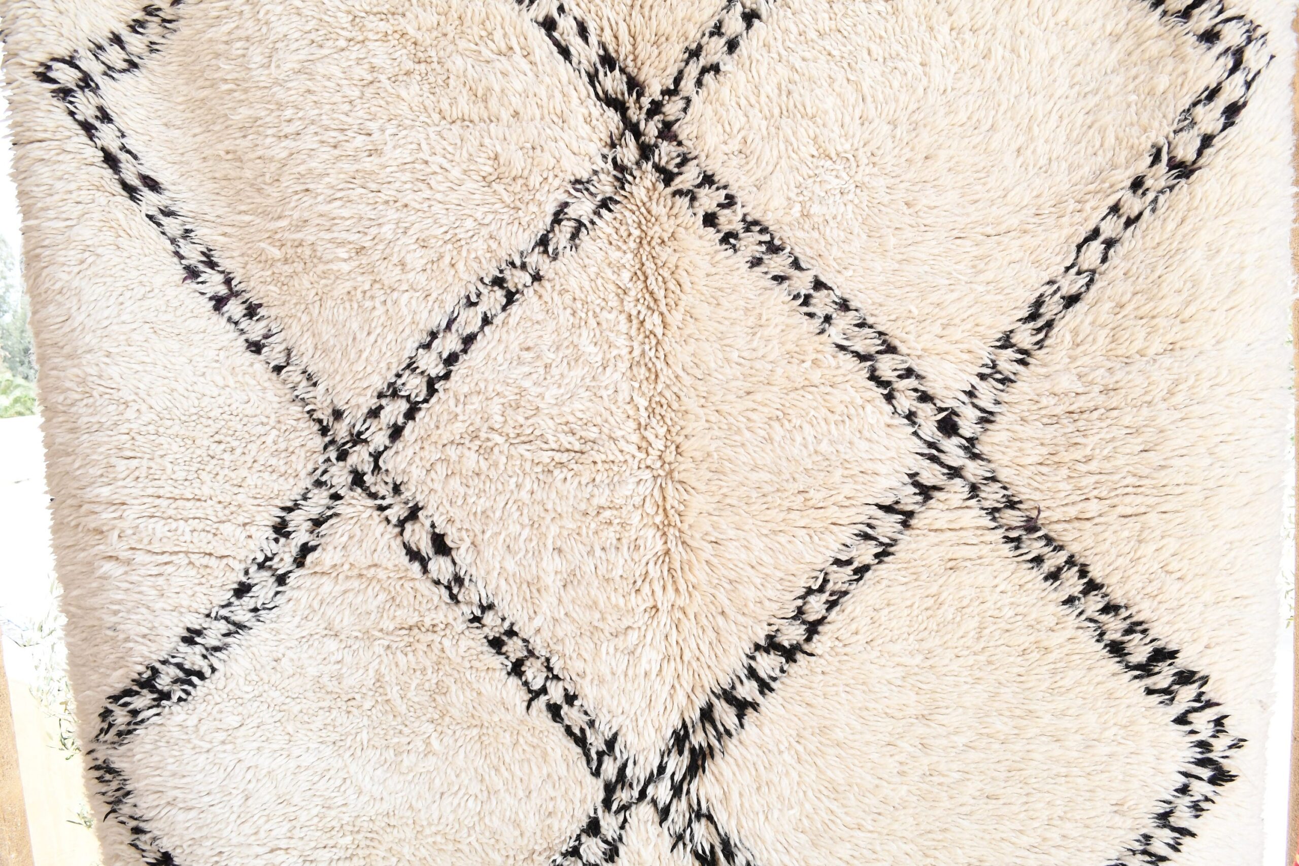 a rug with a black and white pattern. il_fullxfull.6035057144_jq8x.jpg