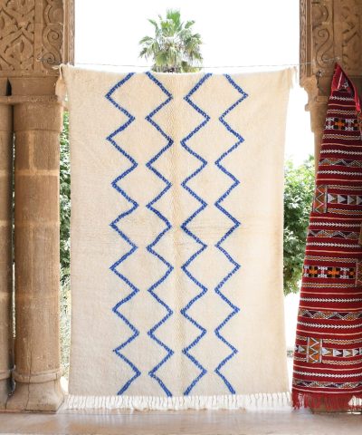 a room with a rug and a chair. il_fullxfull.6035061804_i0ez.jpg