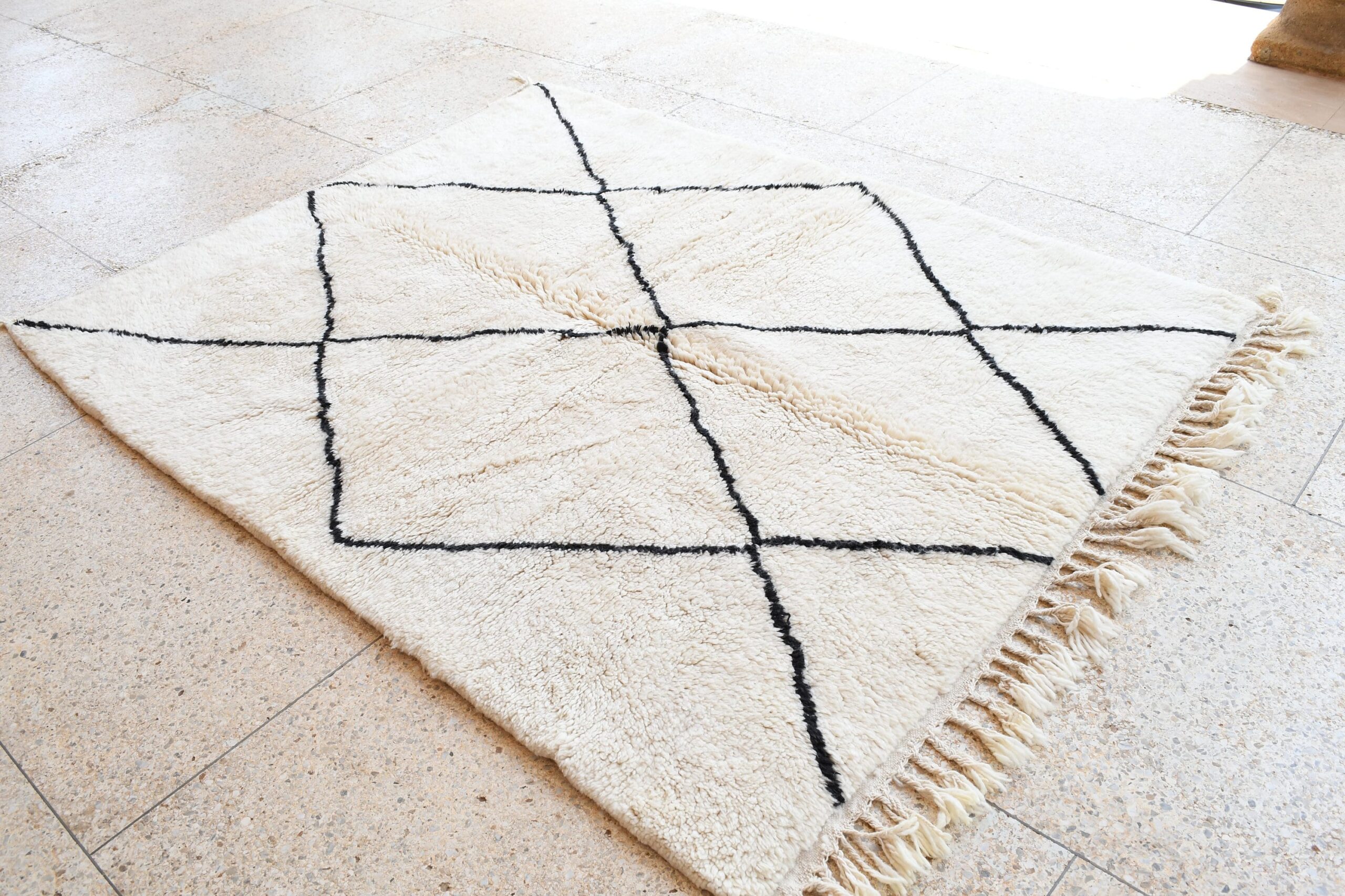 a rug with a black and white pattern on it. il_fullxfull.6035062982_oqfb.jpg