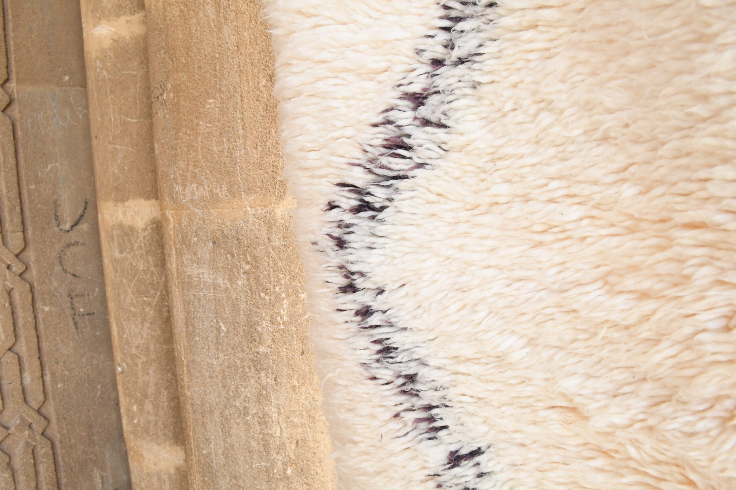 a sheep laying on a wooden floor. il_fullxfull.6035065650_duly-1.jpg