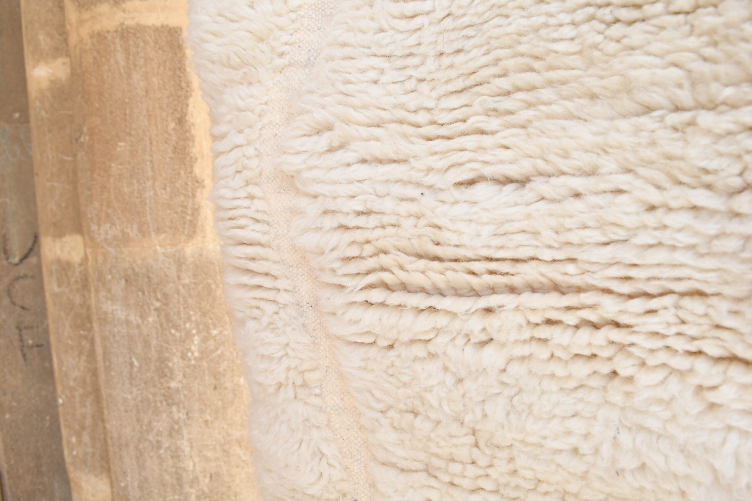 a sheep is standing in a pen with a wooden fence. il_fullxfull.6035074174_r35b-1.jpg