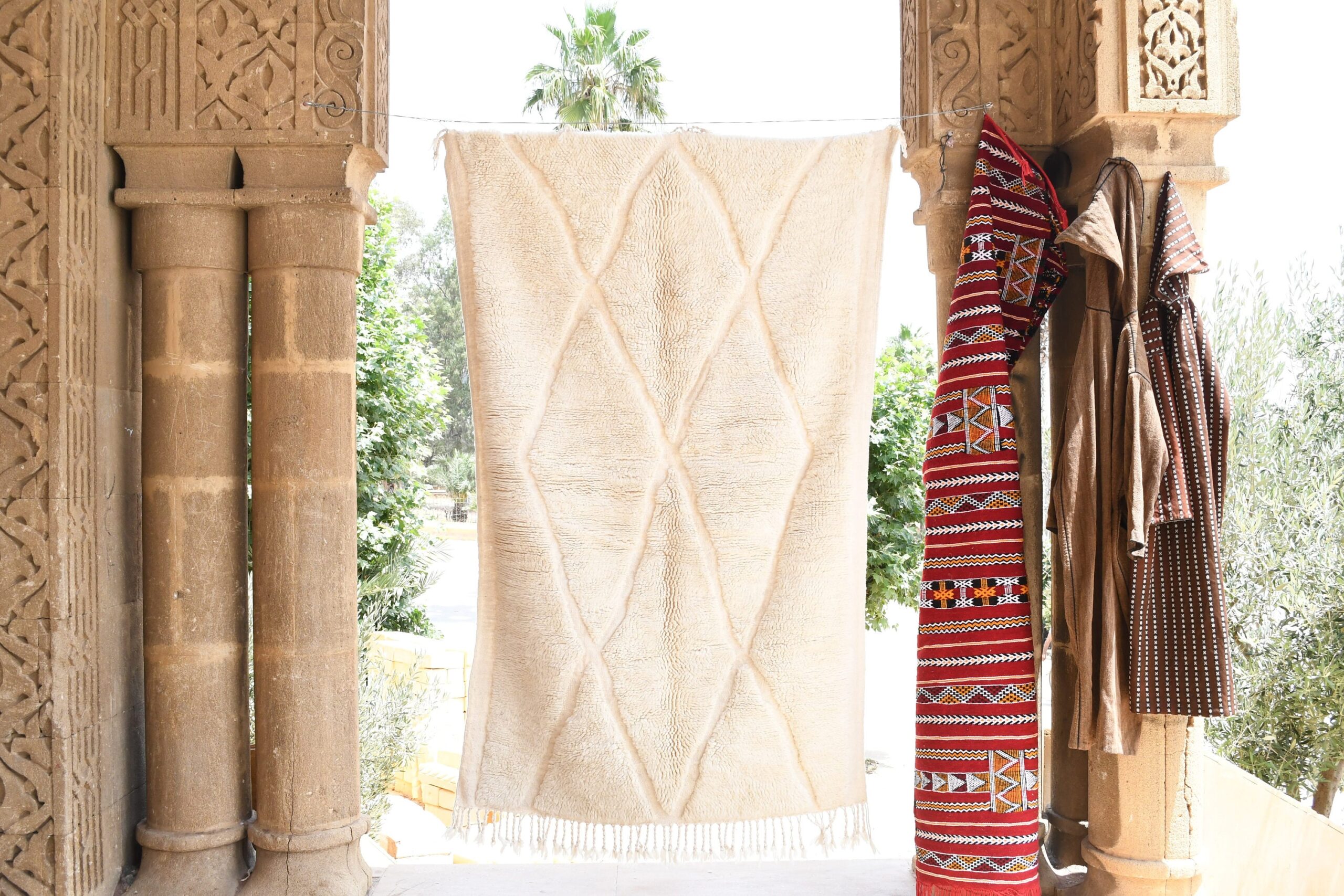 a large white moroccan rug. il_fullxfull.6035074788_szkw.jpg