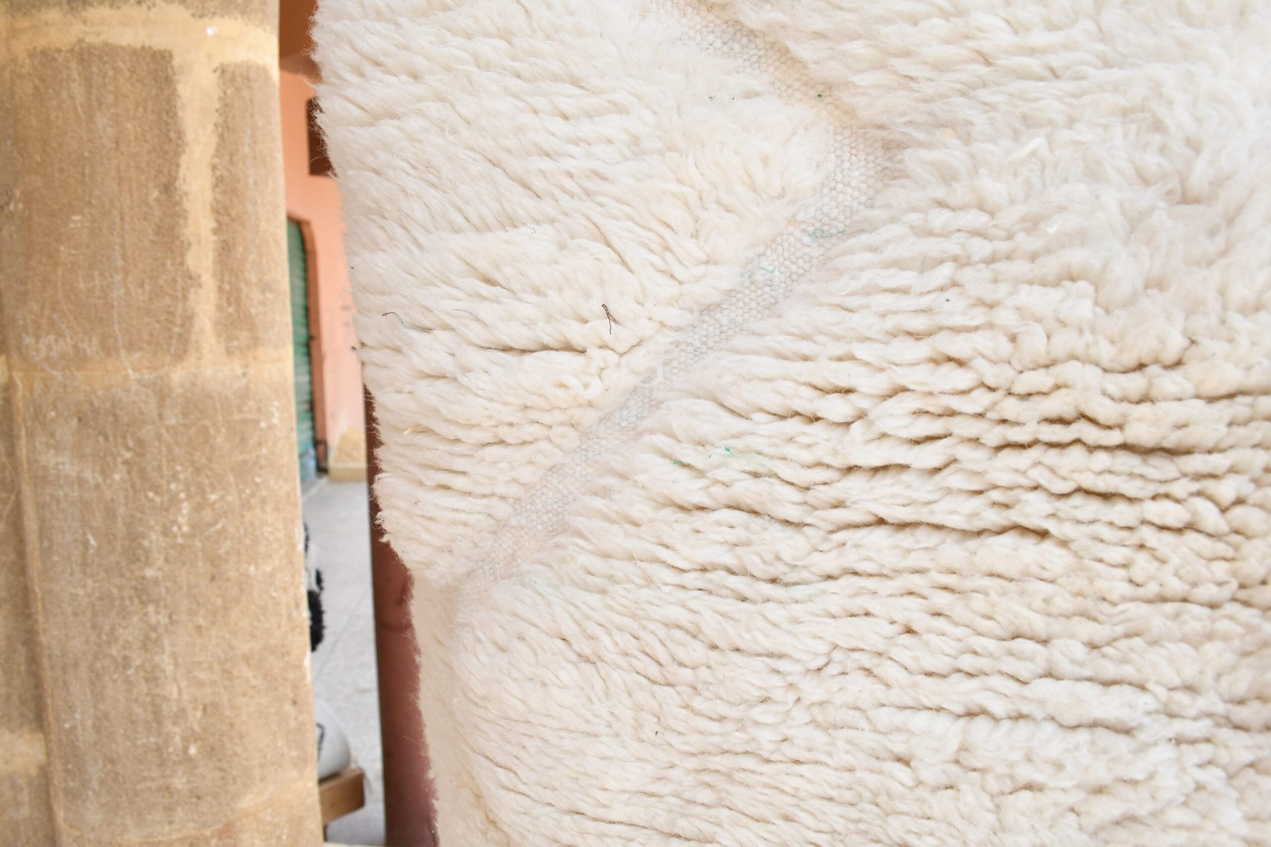 a sheep is standing in a pen with a wooden fence. il_fullxfull.6035079966_glhq-1.jpg