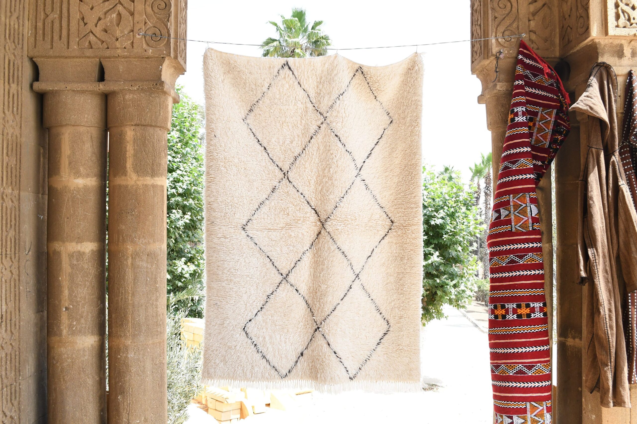 a white rug hanging on a wall. il_fullxfull.6035081926_rmnh.jpg