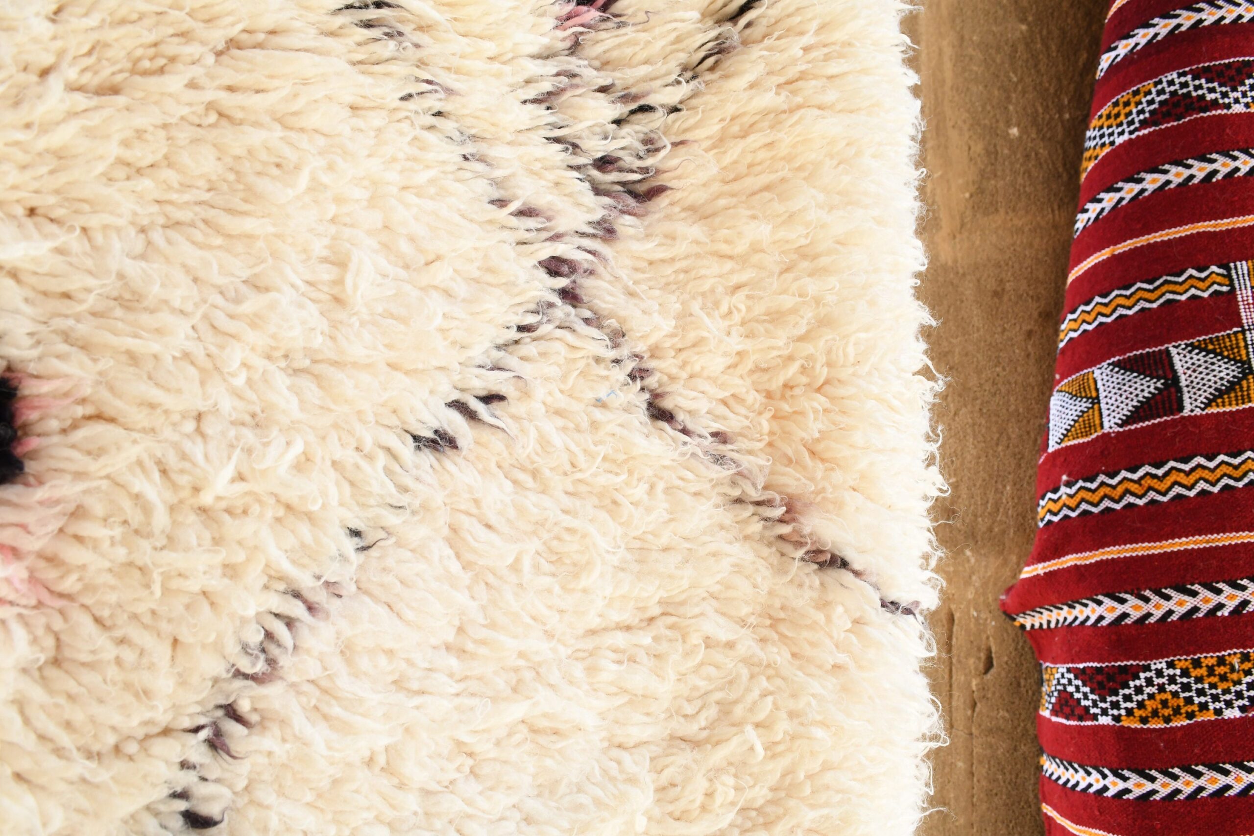 a close up of a sheep laying on a rug. il_fullxfull.6035082436_nmm5.jpg