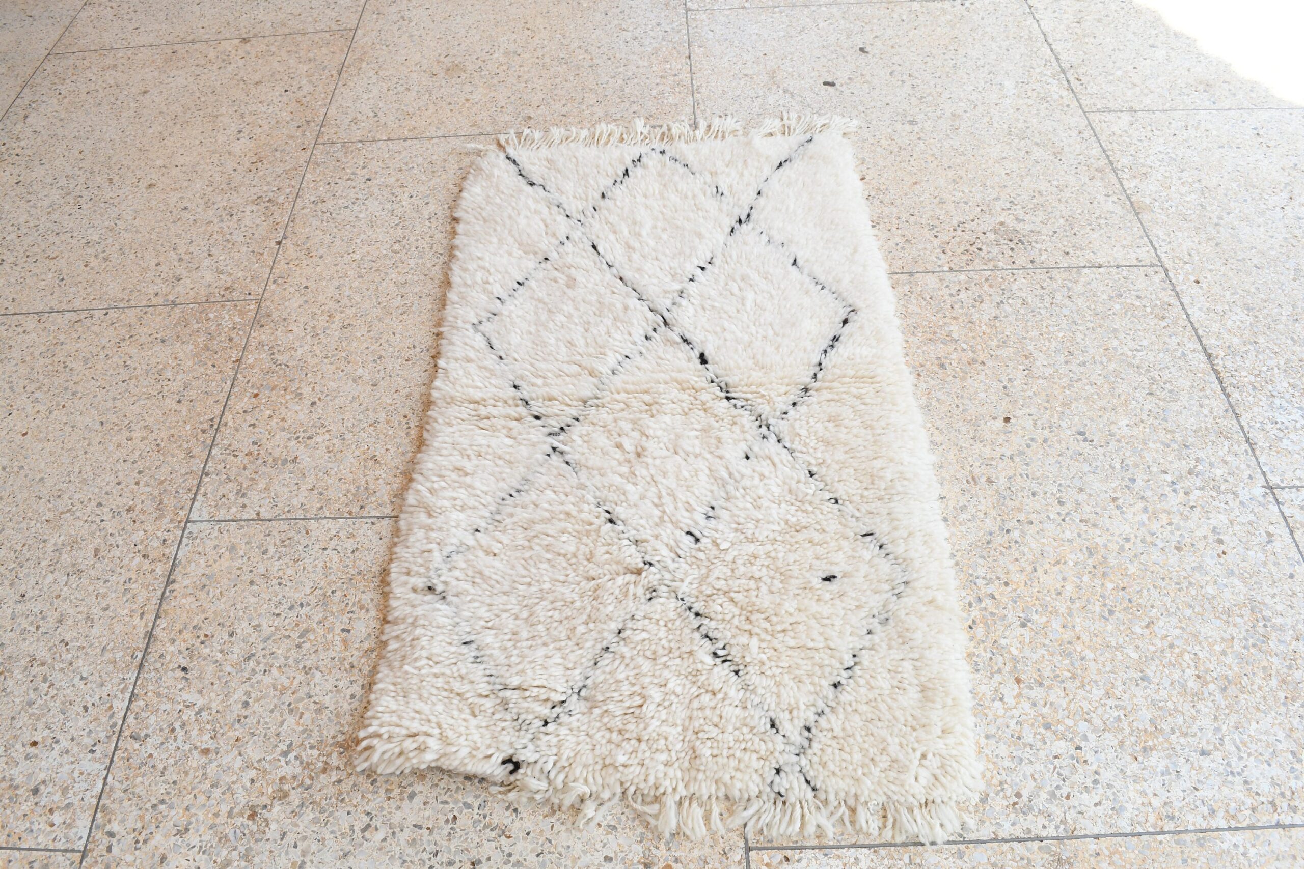 a white rug on the floor. il_fullxfull.6035086190_hlmb.jpg