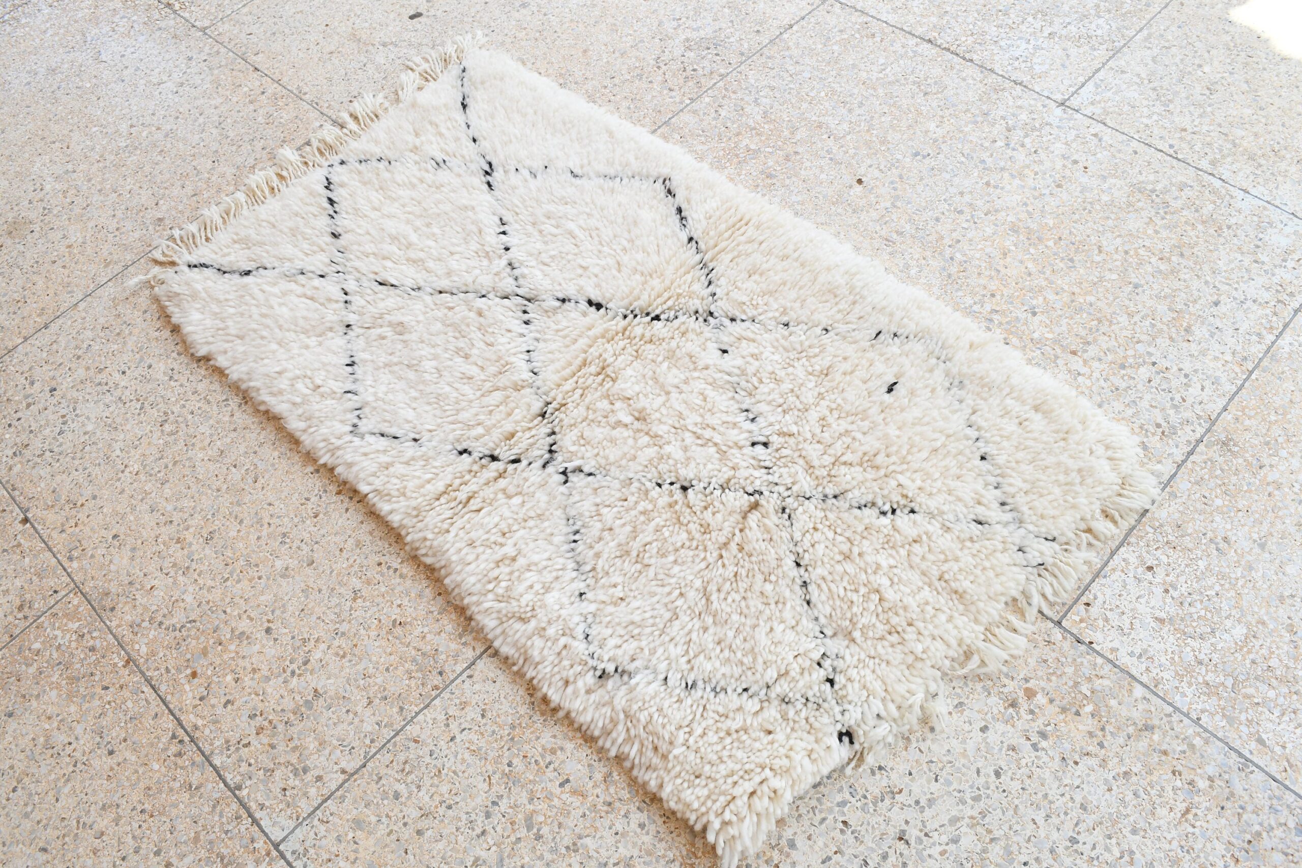 a white rug on the floor. il_fullxfull.6035086520_g94c.jpg