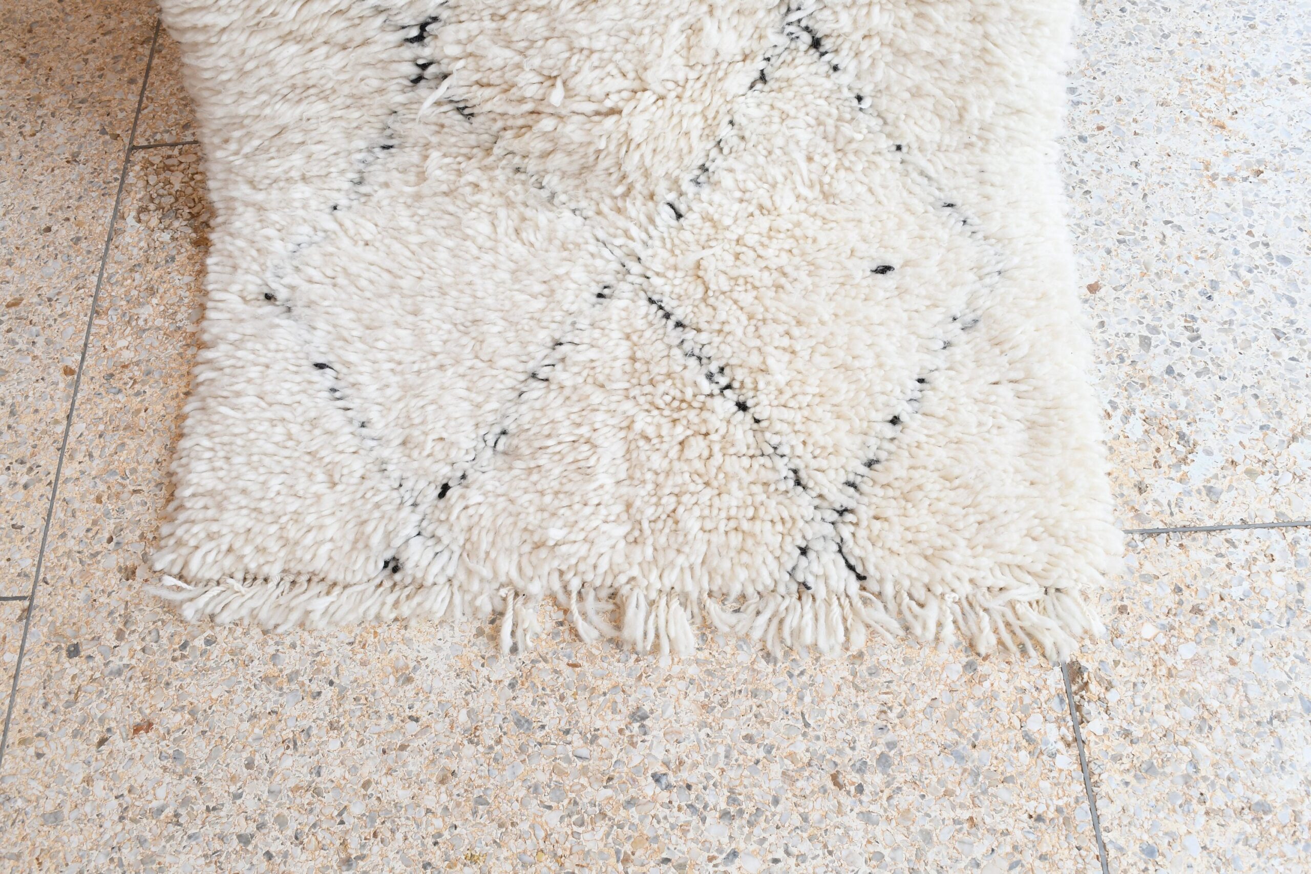 a white rug on the floor. il_fullxfull.6035090562_alvs.jpg