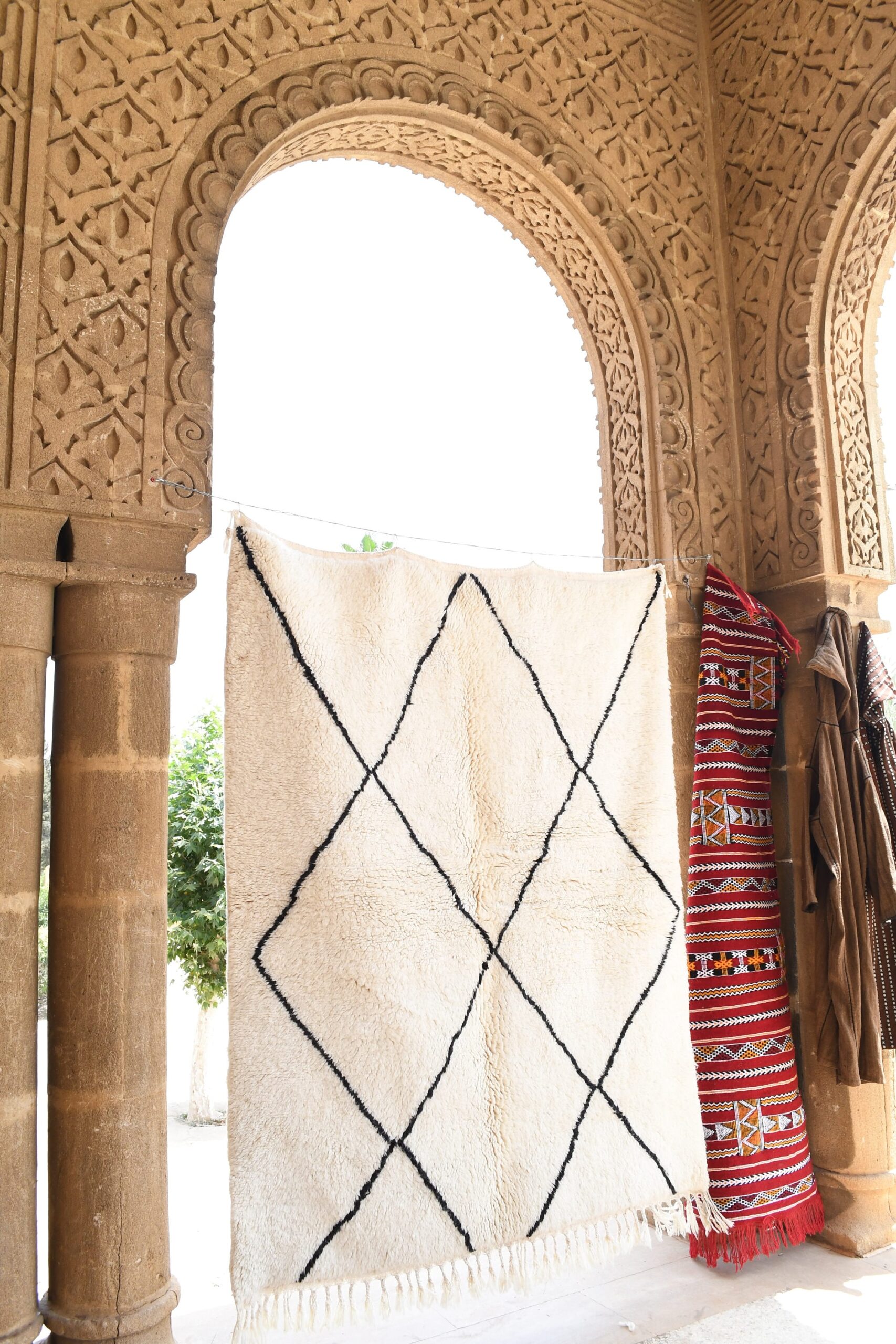 a rug is hanging on a wall in a room. il_fullxfull.6036451408_f8q3.jpg