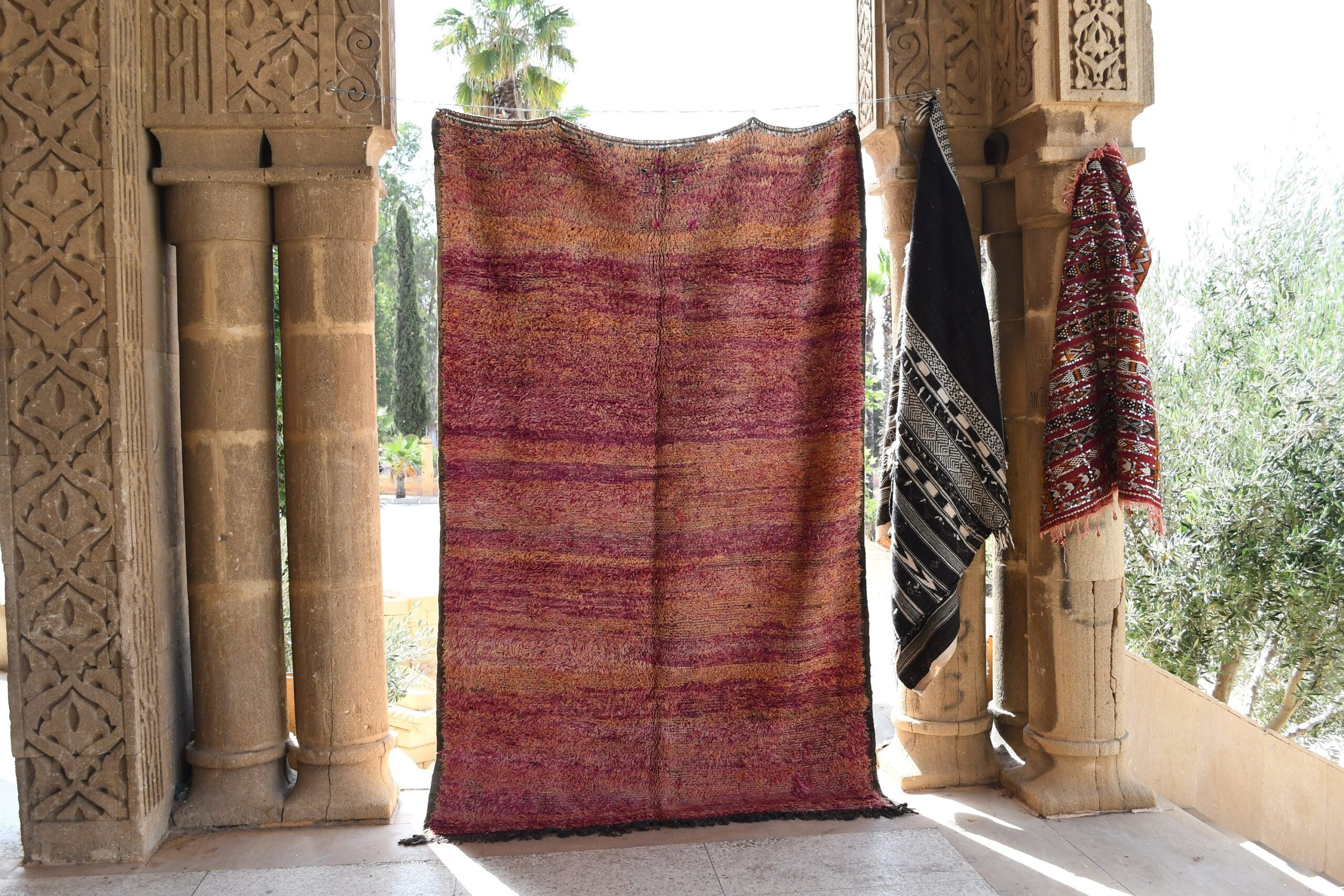 a rug hanging on a wall in a doorway. il_fullxfull.6065252551_g6zt.jpg