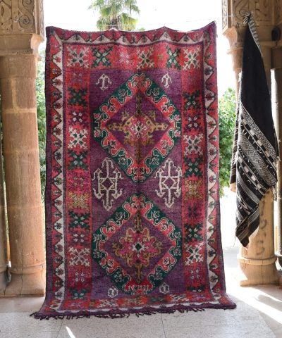 a colorful rug hanging on a wall. il_fullxfull.6065253839_6fv6.jpg