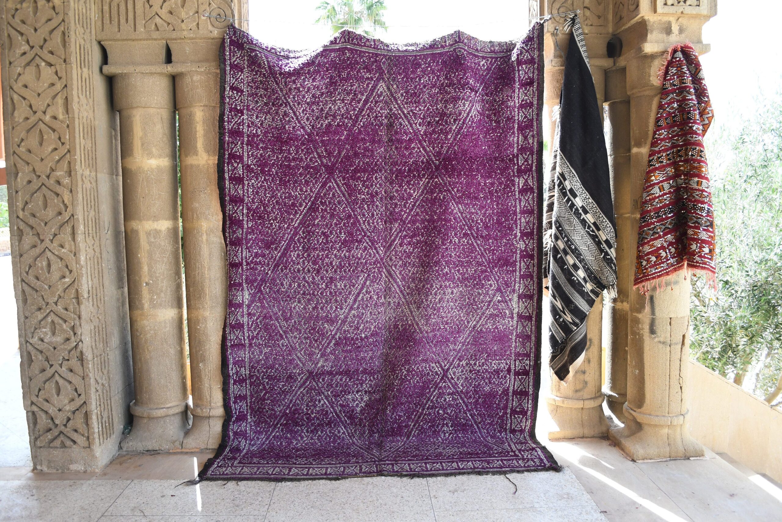 a purple rug hanging on a wall. il_fullxfull.6065255149_o28t.jpg