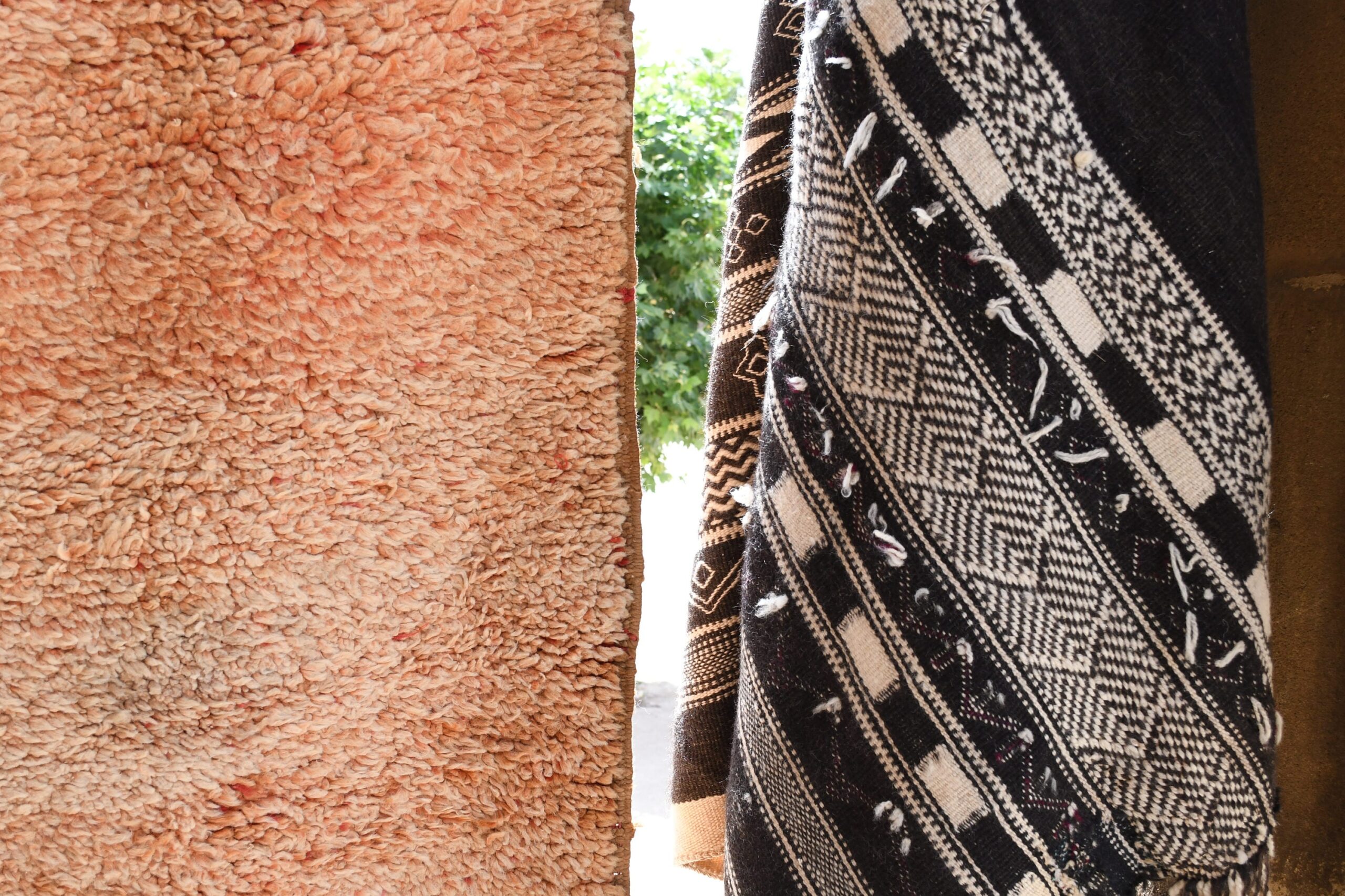 a moroccan rug is hanging on a wall. il_fullxfull.6065261161_cayb.jpg