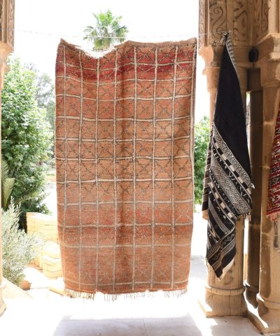 a red and black moroccan rug hanging on a wall. il_fullxfull.6065263009_4hcg.jpg