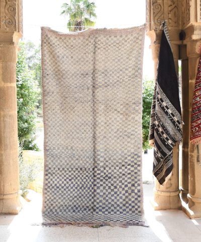 a white and black moroccan rug. il_fullxfull.6065265039_ci2d.jpg