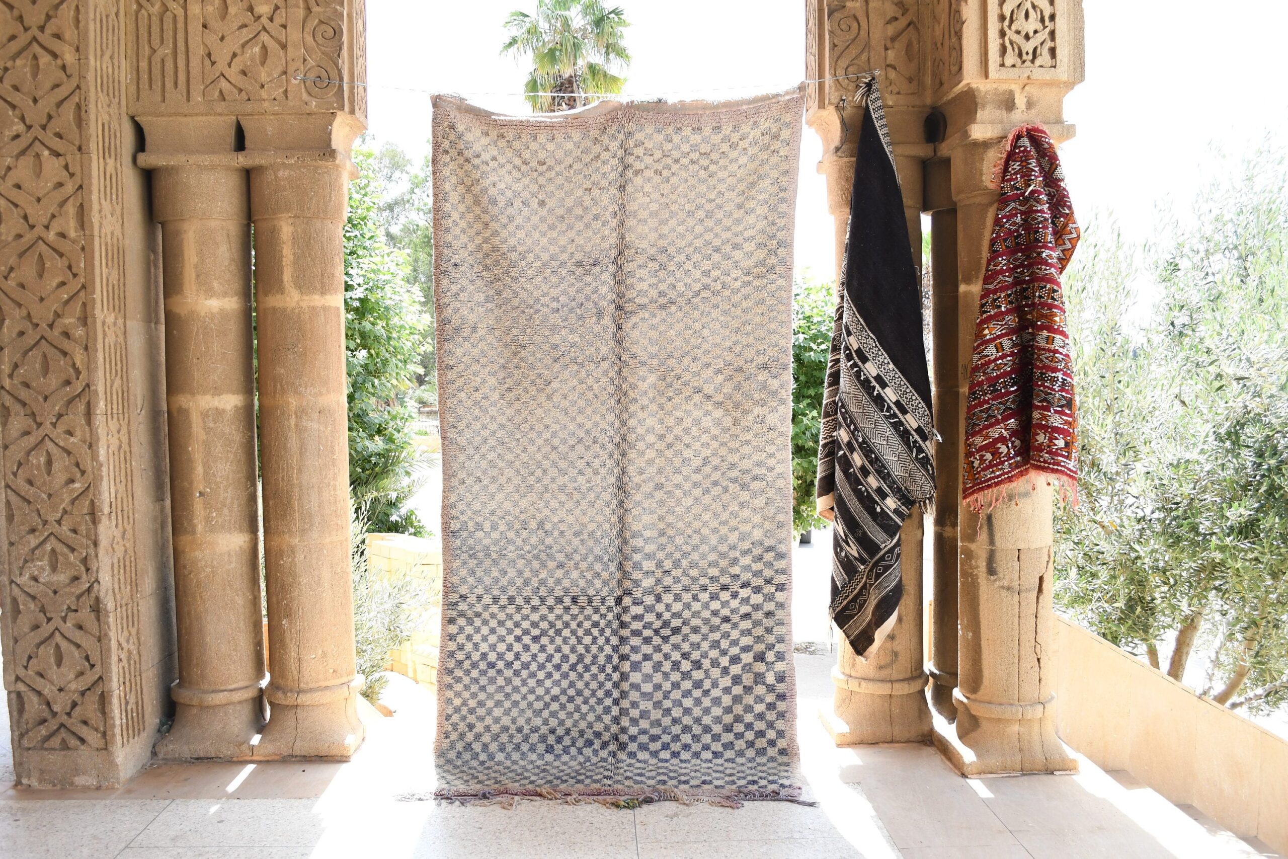 a white and black moroccan rug. il_fullxfull.6065265039_ci2d.jpg