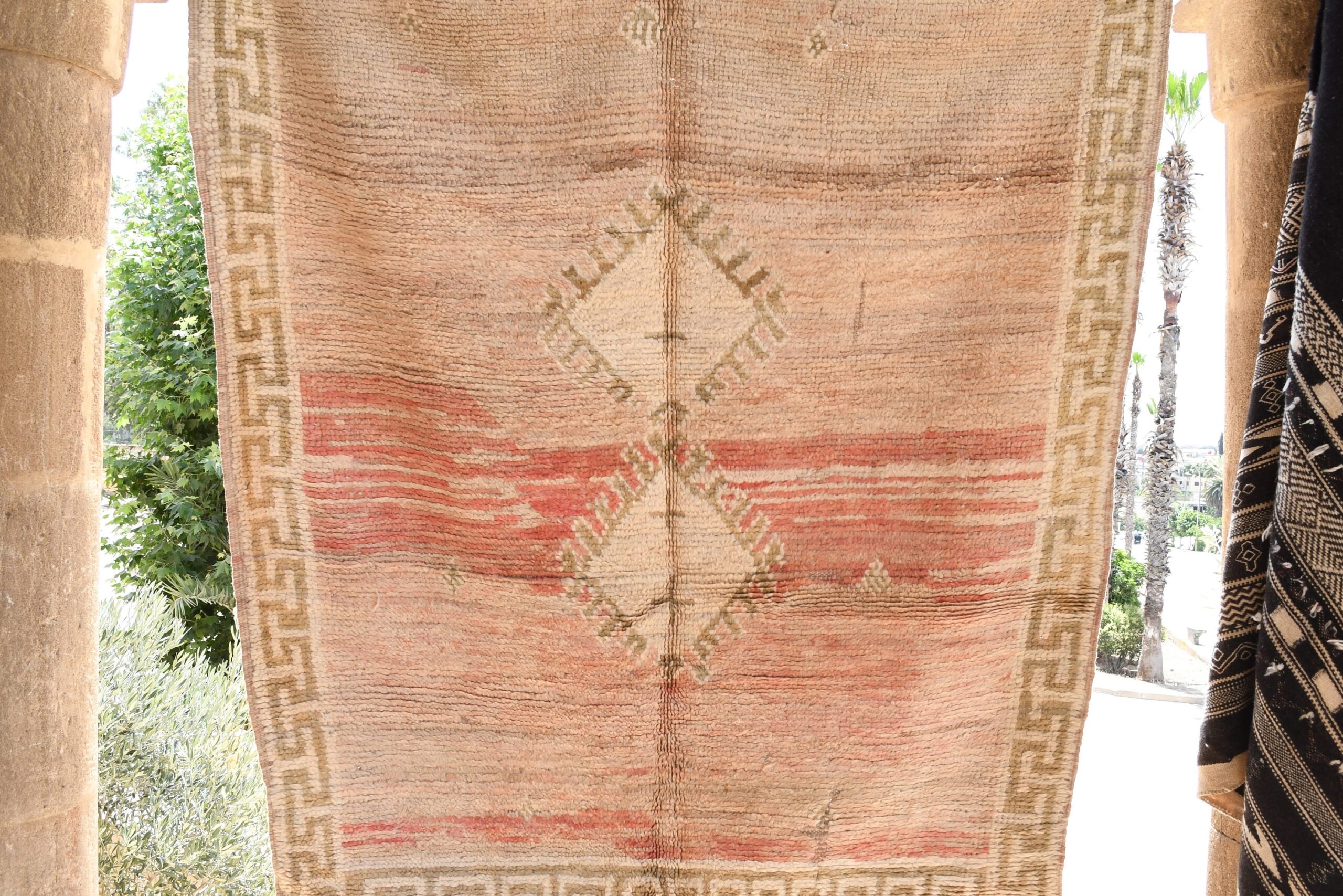 a rug hanging on a wall. il_fullxfull.6065267039_elkw.jpg