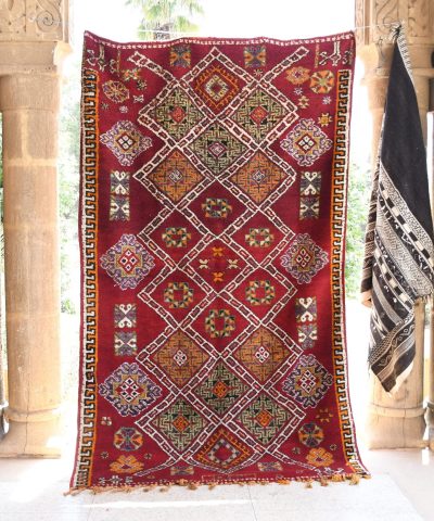 a red and yellow rug hanging on a wall. il_fullxfull.6065271021_6ckn.jpg