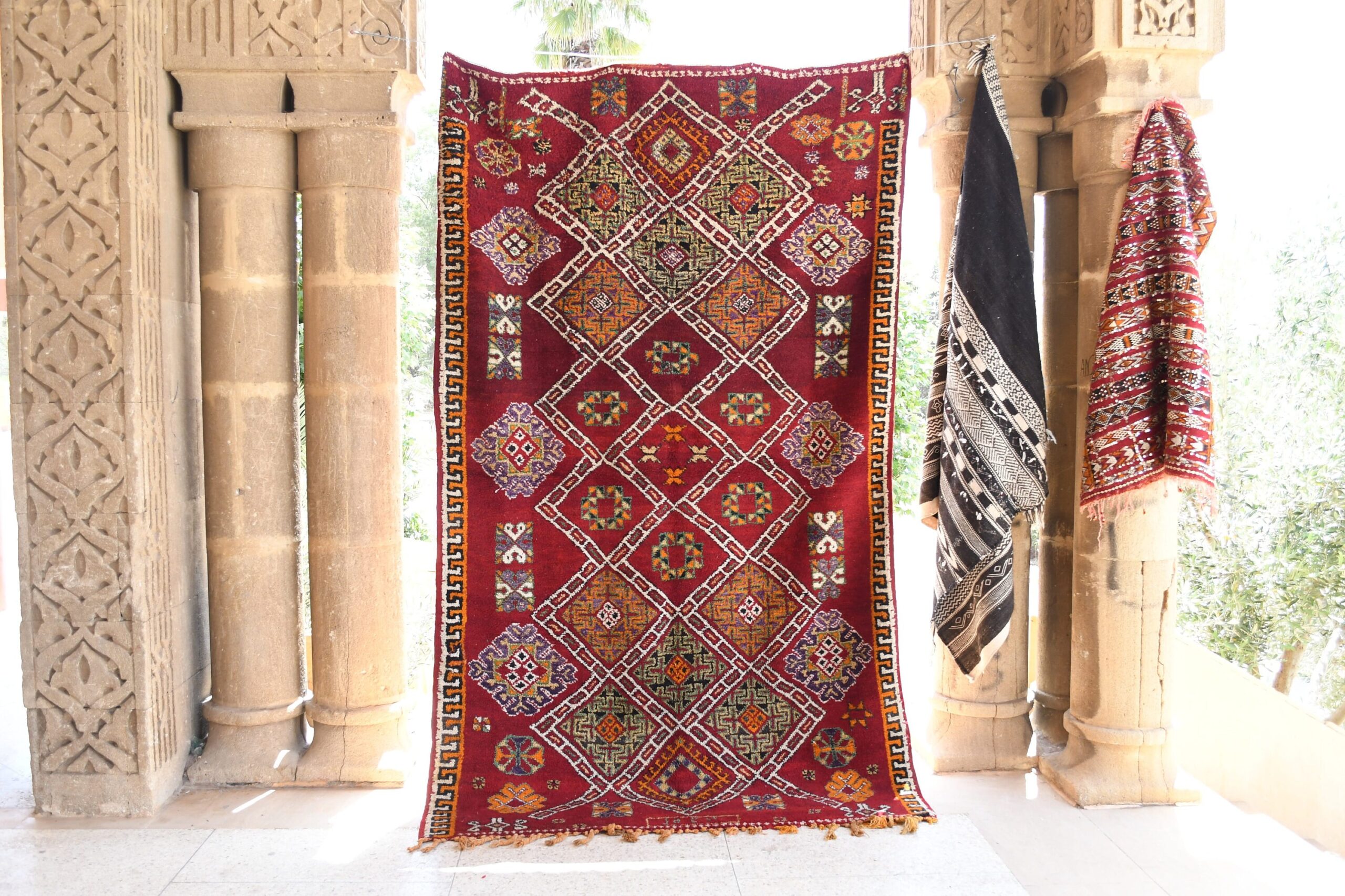 a red and yellow rug hanging on a wall. il_fullxfull.6065271021_6ckn.jpg