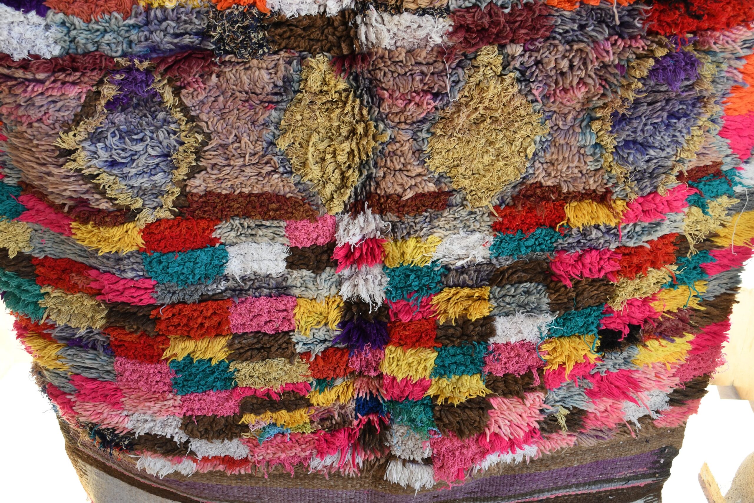 a colorfully colored vest with a large patch on the back. il_fullxfull.6065277449_fjzb.jpg