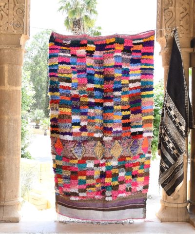 a colorful moroccan rug hanging on a wall. il_fullxfull.6065507617_mm7h.jpg