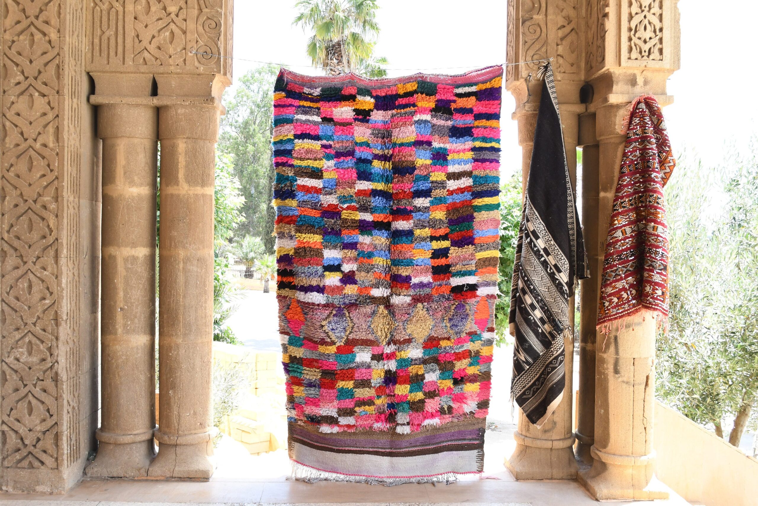 a colorful moroccan rug hanging on a wall. il_fullxfull.6065507617_mm7h.jpg