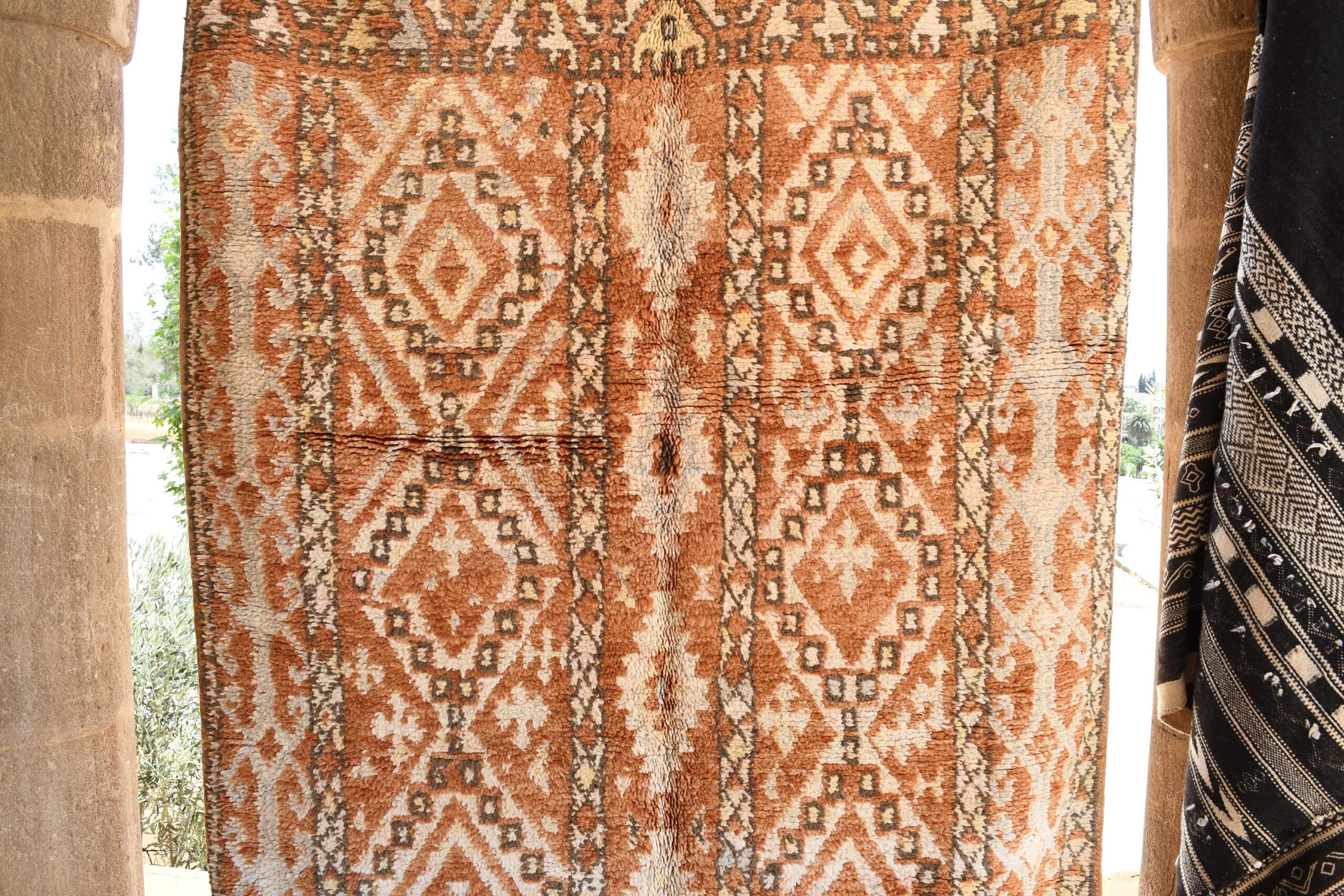 a rug hanging on a wall. il_fullxfull.6065521759_laqq.jpg