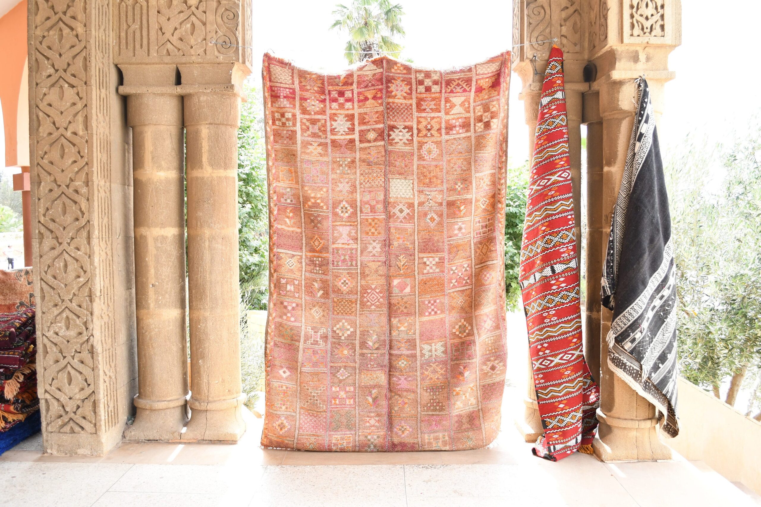 a woman sitting on a bench in front of a doorway. il_fullxfull.6065530453_dqmo.jpg