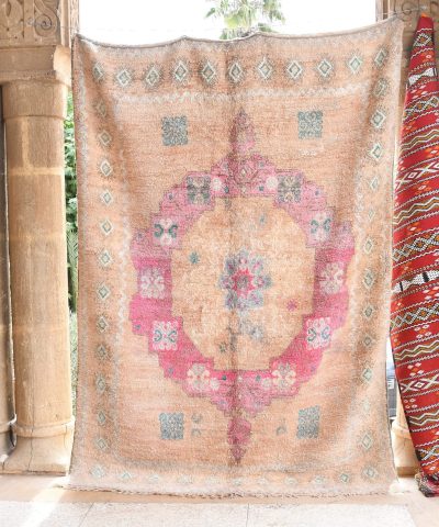 a rug hanging on a wall in a room. il_fullxfull.6065535347_2i6x.jpg