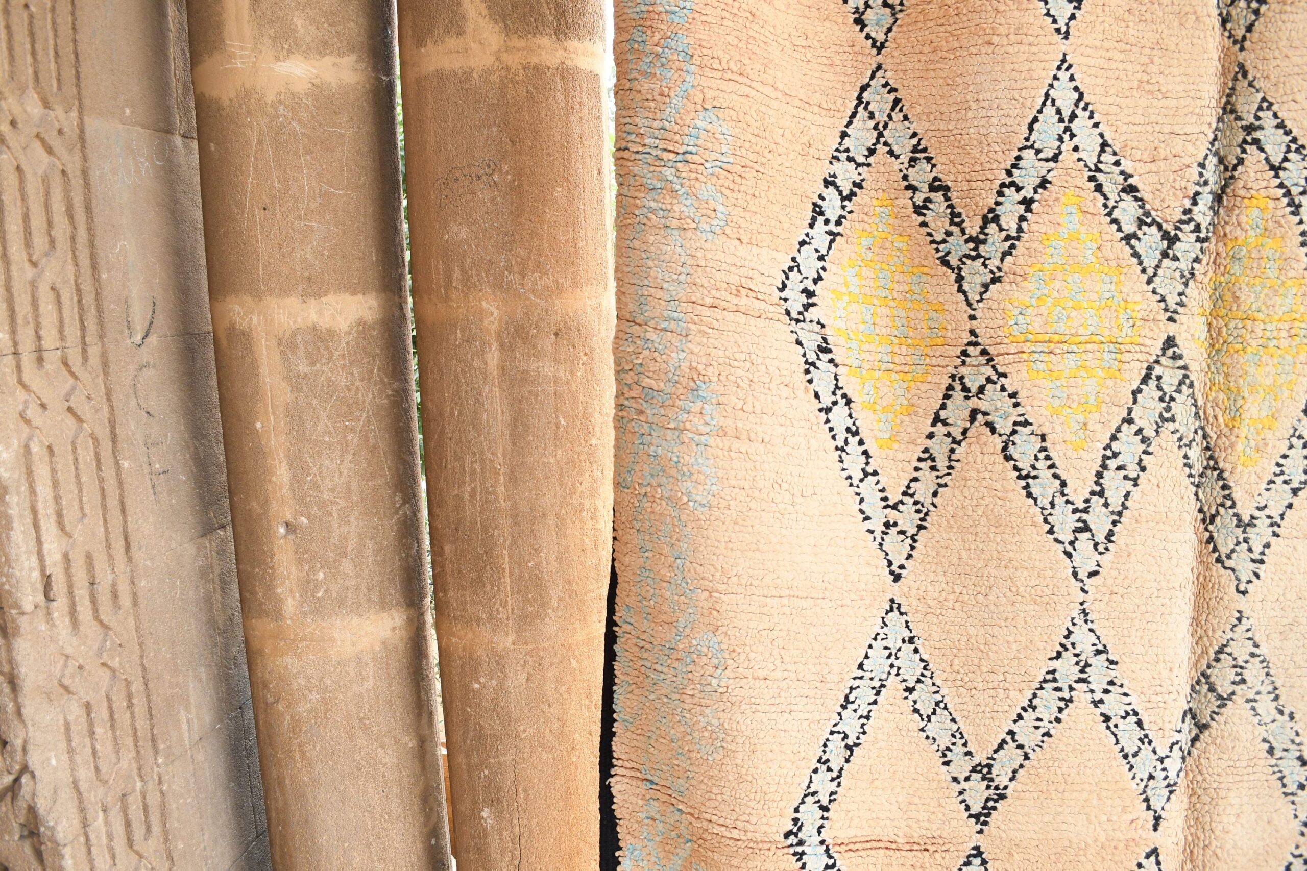 a cat sitting on a wooden bench next to a wall. il_fullxfull.6065537857_5ga2.jpg