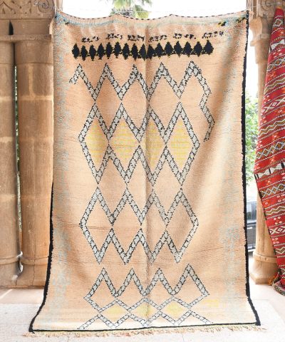 a large moroccan rug with a geometric design. il_fullxfull.6065538251_thhp.jpg