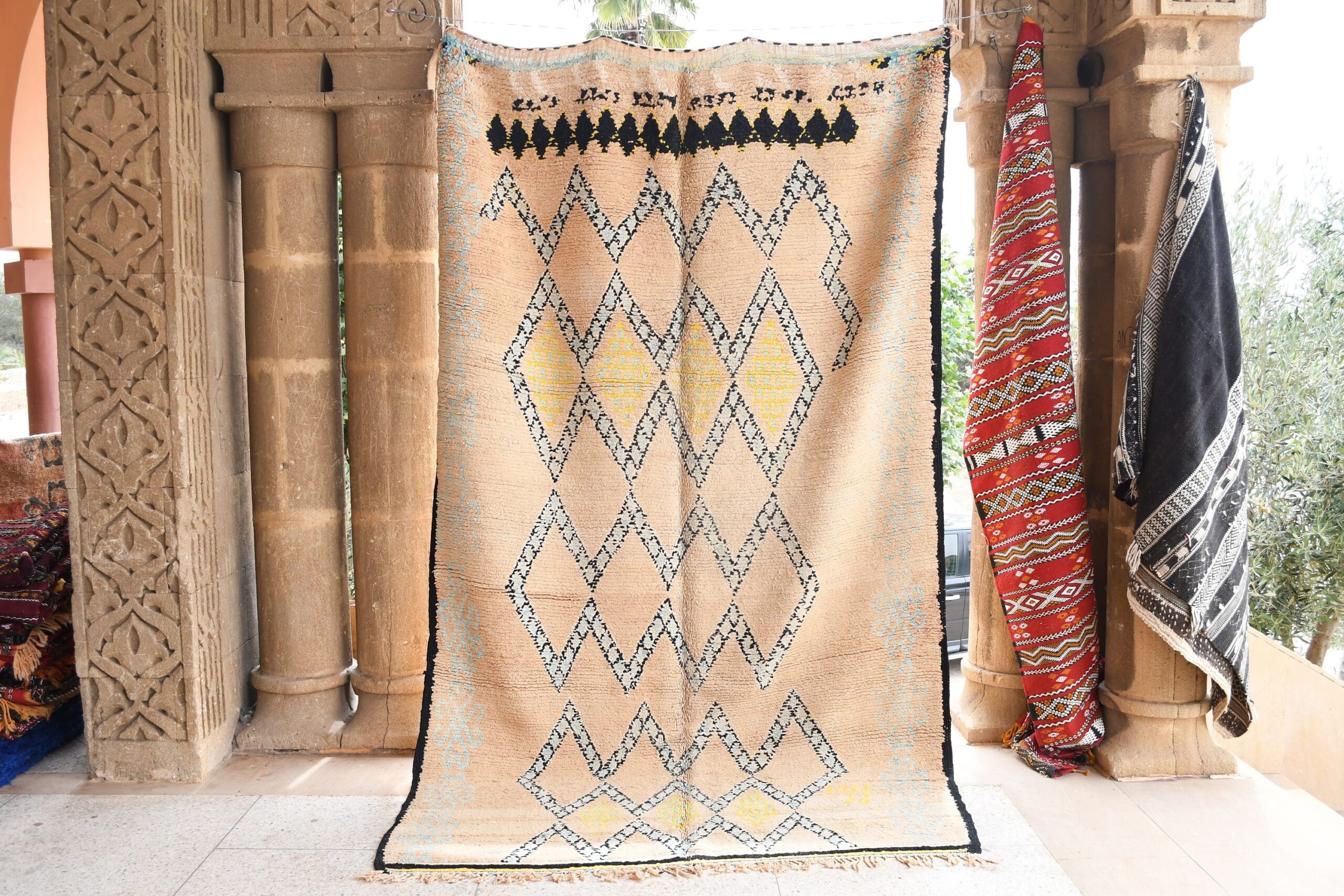 a large moroccan rug with a geometric design. il_fullxfull.6065538251_thhp.jpg