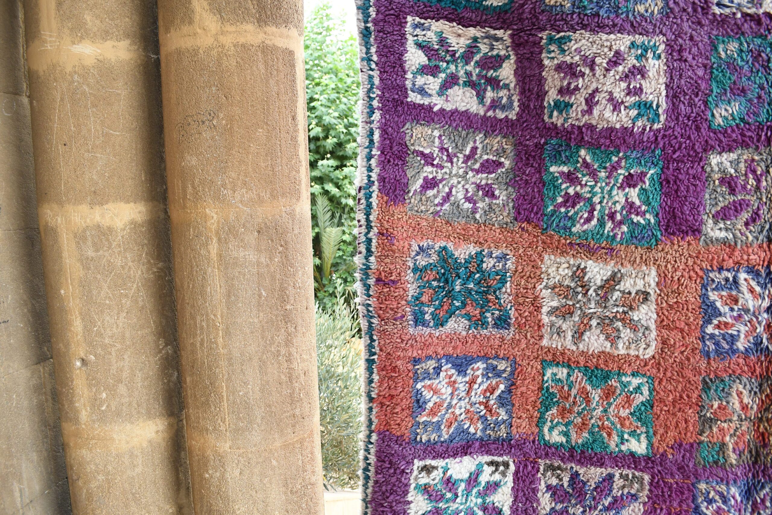 a purple and blue rug hanging on a wall. il_fullxfull.6065550651_30pr.jpg