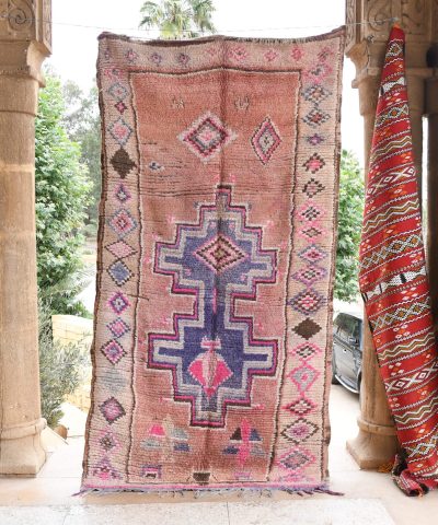 a colorful rug hanging on a wall. il_fullxfull.6065552739_bom9.jpg